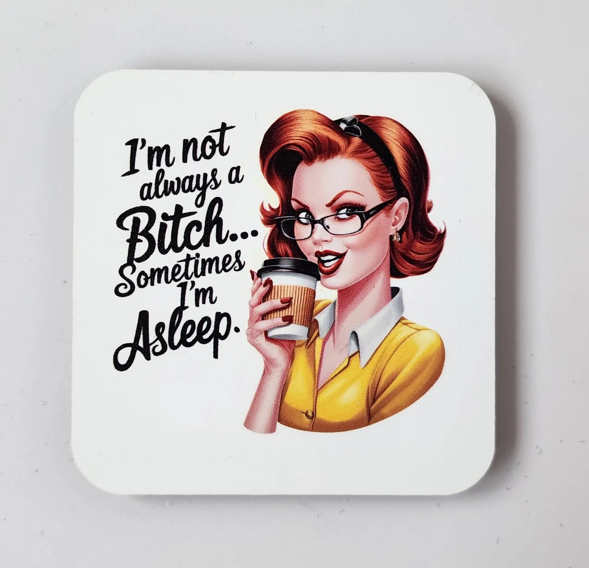 Consider the Snarky "I'm Not Always a Bitch, Sometimes I'm Asleep" Magnet by Mirabilia Boutique. This quirky gift showcases a retro-style illustration of a sassy red-haired woman with glasses, donning a yellow sweater over a white shirt while holding a coffee cup. It's perfect for adding some snark to your fridge!