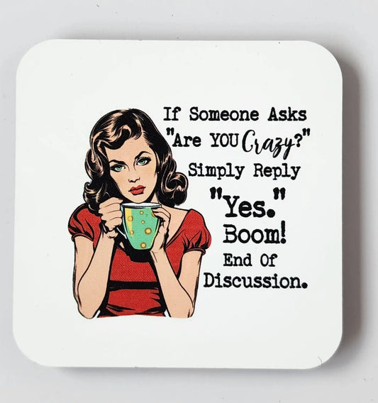 A retro-style image of a woman with curled brown hair, wearing a red shirt, holding a cup. Text beside her reads, "If someone asks 'Are YOU crazy?' Simply reply 'Yes.' Boom! End of discussion." This humorous fridge magnet from Mirabilia Boutique is called "If Someone Asks If You're Crazy Say Yes Magnet" and makes for a funny gift sure to bring smiles.