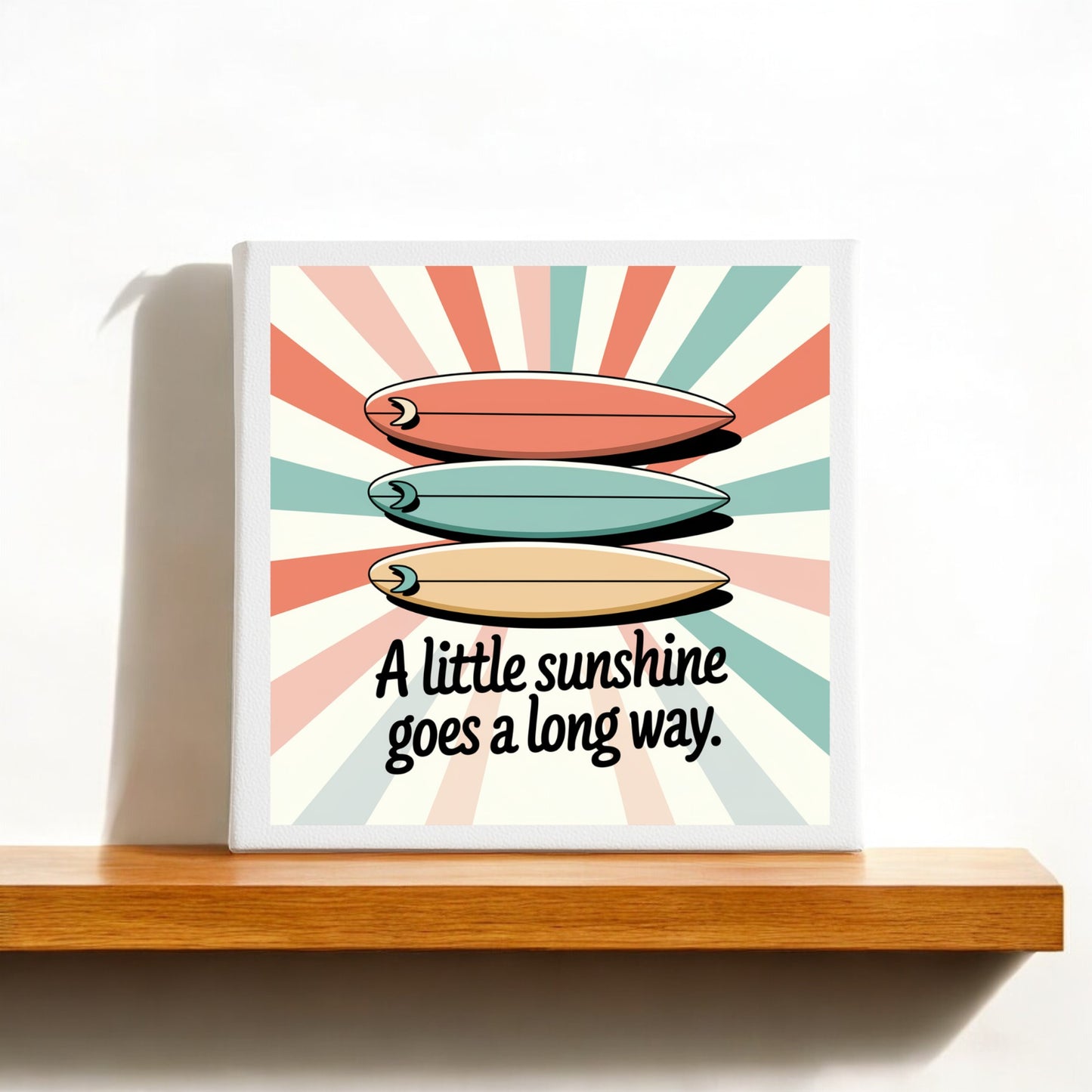 The "A Little Sunshine Canvas – Retro Surf Summer Vibes" by Mirabilia Boutique features three vibrant surfboards on a vintage sunburst, with the text "A little sunshine goes a long way"—a perfect wall decor accent for any space.