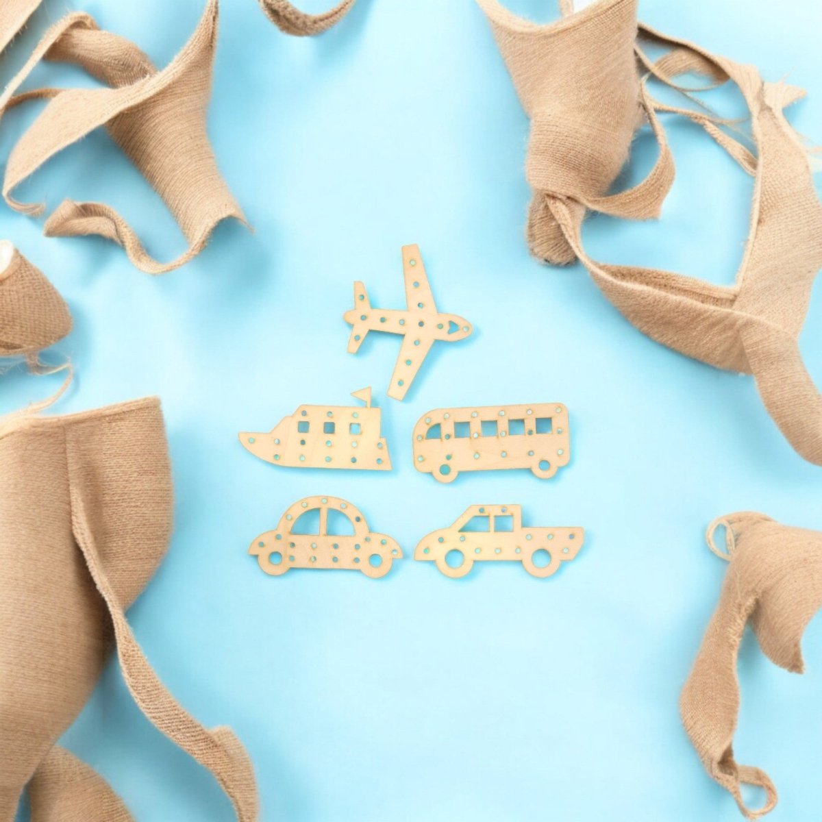 Mirabilia Boutique’s Transportation Vehicle Lacing Trays for Kids—featuring plane, ship, bus, car, and truck cutouts on a blue background with tan laces—are perfect for boosting fine motor skills and preschool learning.