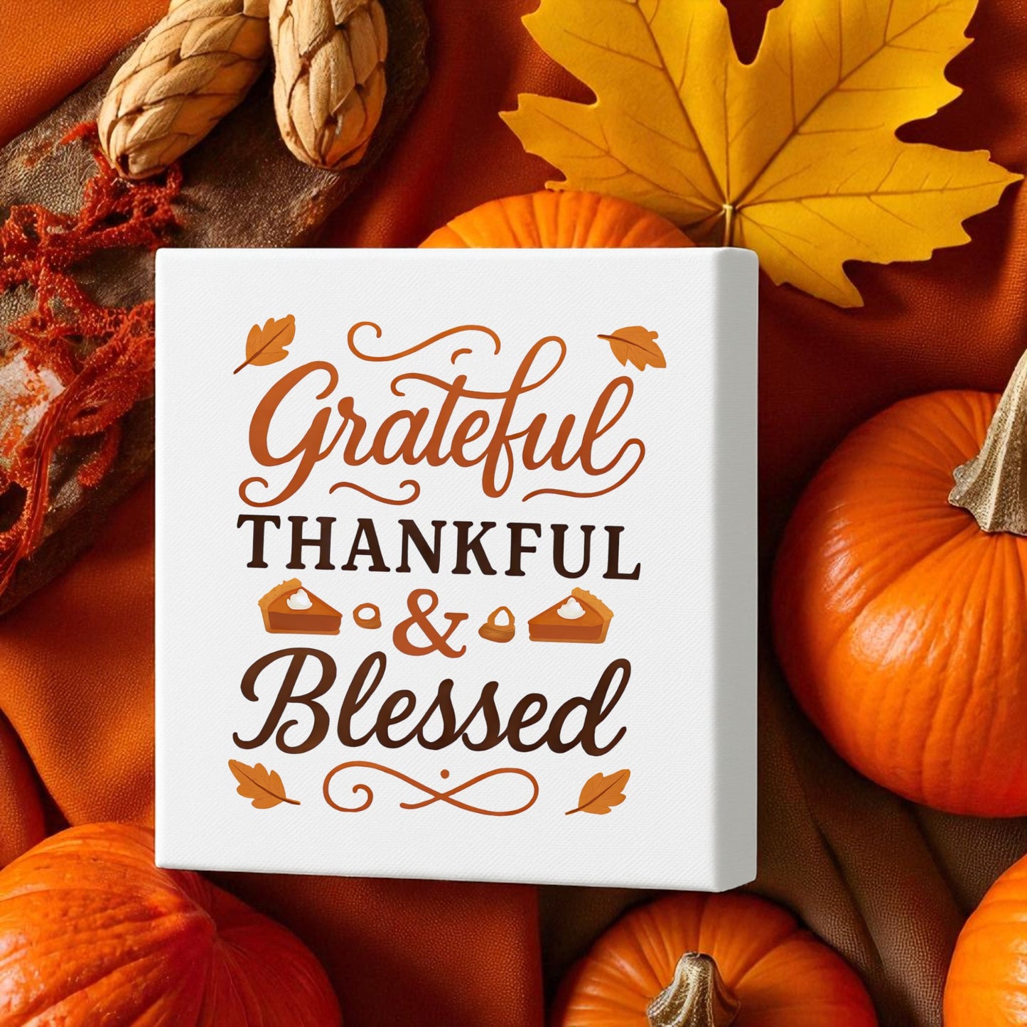 The Grateful Thankful Blessed Canvas (8x8) from Mirabilia Boutique features autumn pumpkins, leaves, and acorns—perfect fall wall art for warming up your space and celebrating Thanksgiving.