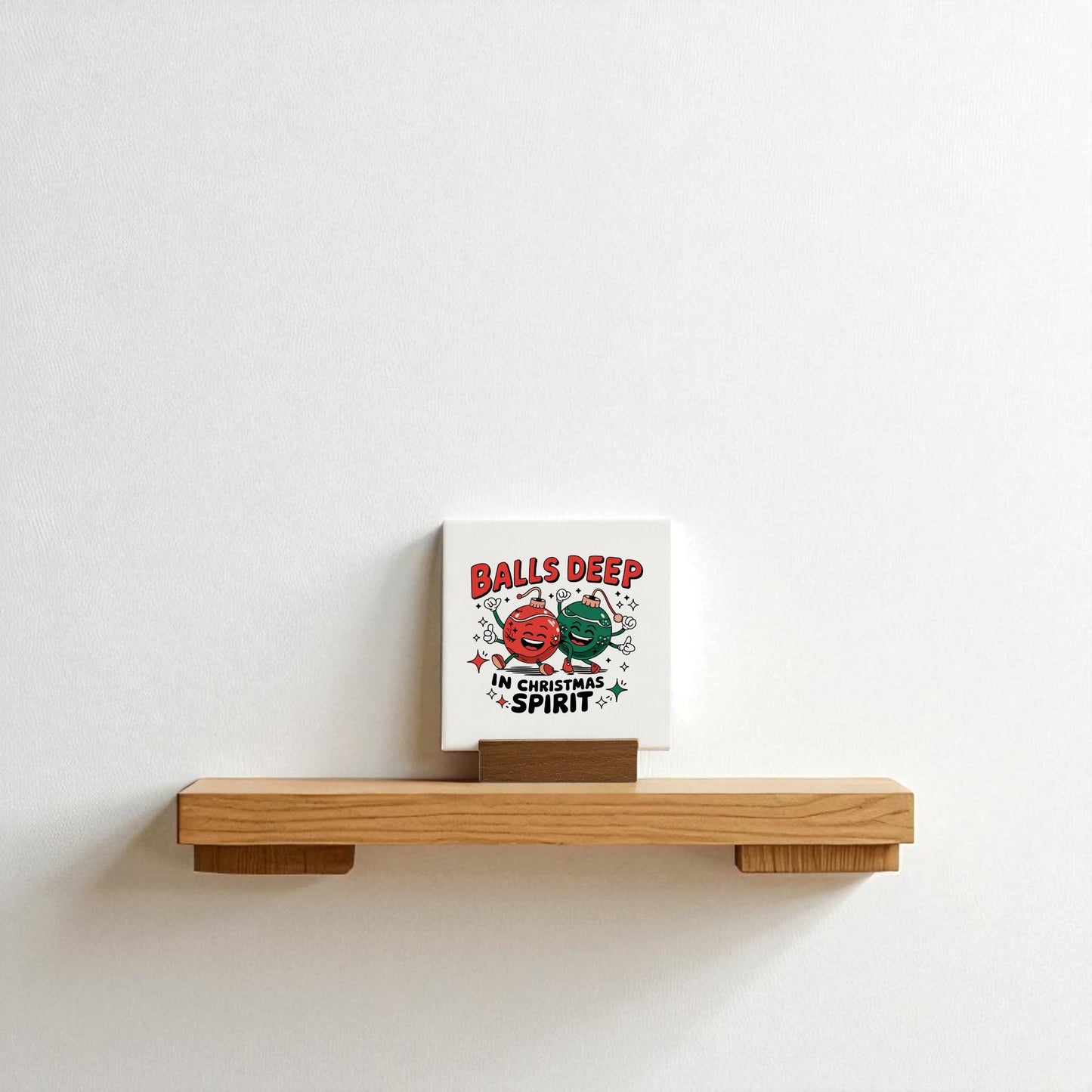 The Mirabilia Boutique "Balls Deep in Christmas Spirit | Funny Mini Holiday Sign" is a playful adult Christmas decor piece featuring cartoon festive ornaments, perfect for adding humor to your holiday shelf or mantel.