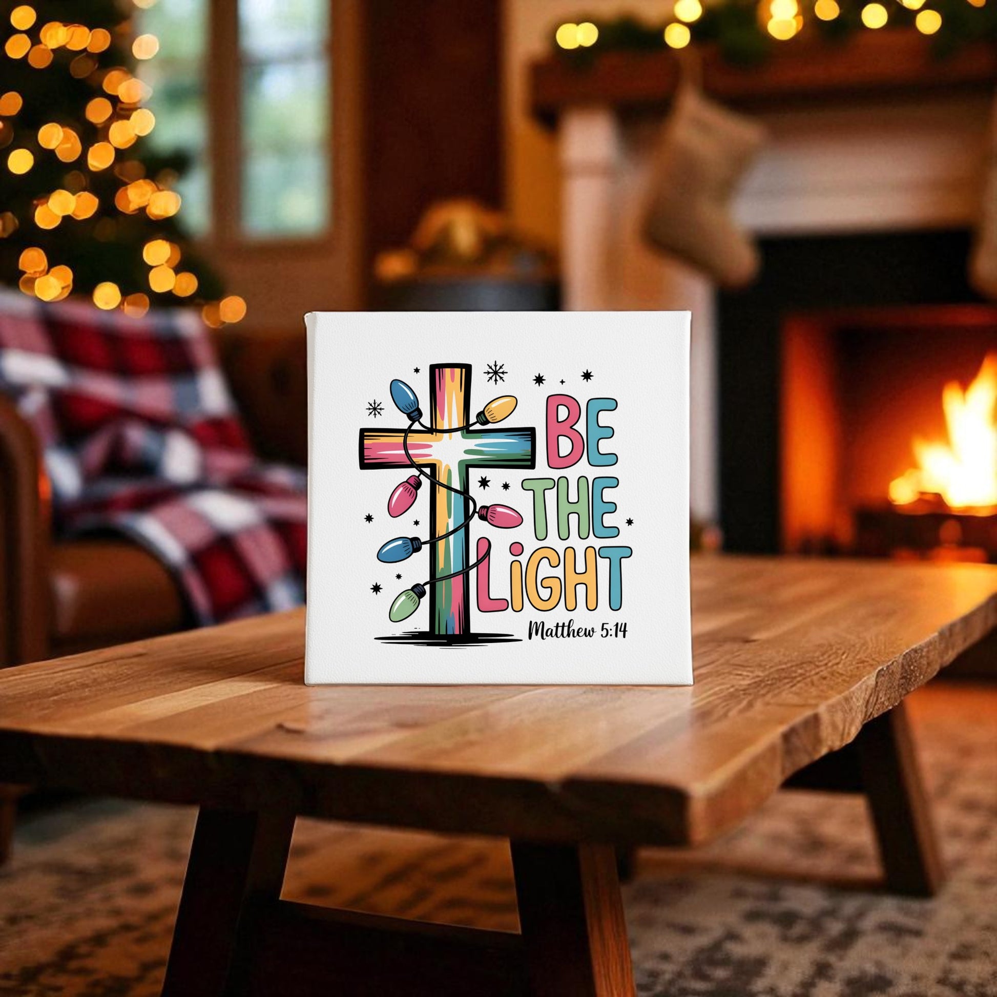 The "Be the Light | Faith-Inspired Christmas Decor | Matthew 5:14" canvas from Mirabilia Boutique brings uplifting holiday spirit to your living room, featuring glowing lights that shine near your fireplace and Christmas tree.