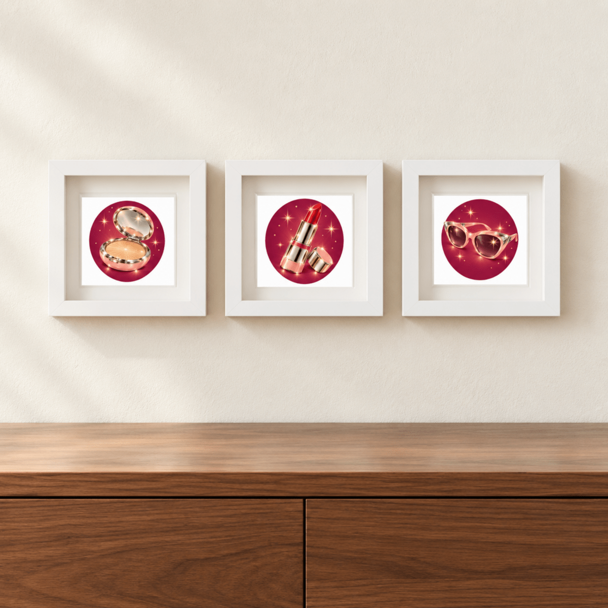 Three white-framed Beauty Rituals of Chrome & Starlight | Mirabilia Relics prints by Mirabilia Boutique hang on a beige wall above a wooden cabinet, each featuring bold red circles with beauty icons.