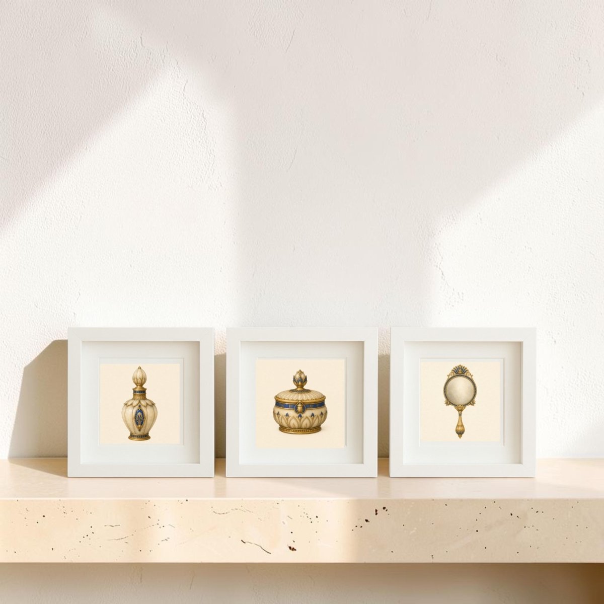 Three framed canvas artworks from Mirabilia Boutique’s “Beauty Rituals of the Nile Relics | Mirabilia Relics” collection—a perfume bottle, a lidded jar, and a hand mirror—sit side by side on a beige stone shelf, evoking timeless beauty rituals as sunlight casts soft shadows on the wall behind them.