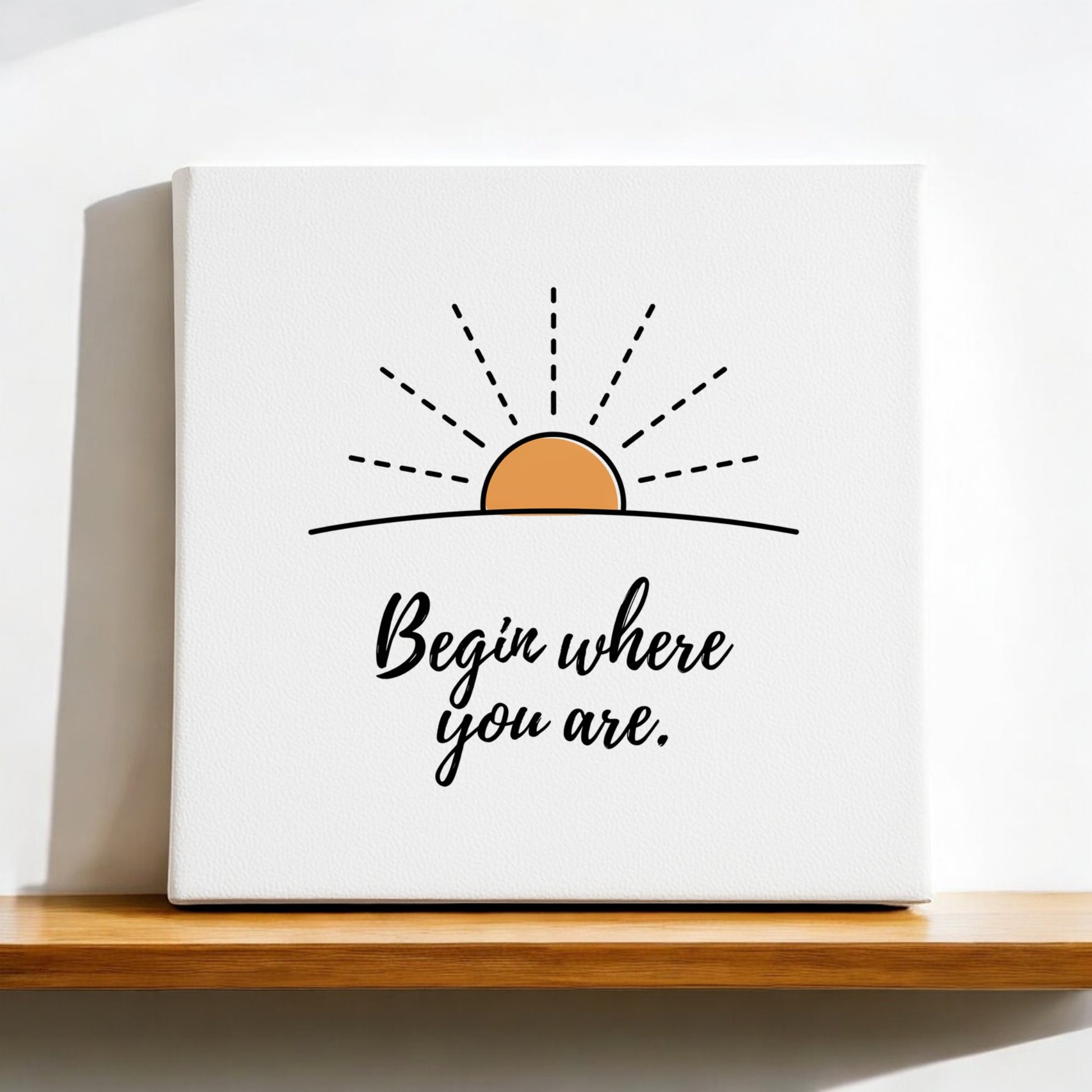 The Begin Where You Are Canvas – Sunrise Wall Affirmation by Mirabilia Boutique displays a minimalist sunrise and the phrase "Begin where you are." in black cursive, making calming wall art for any space.