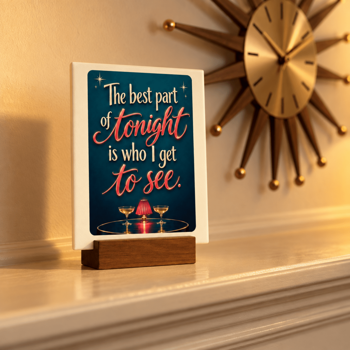The Best Part of Tonight Mini Sign | Chrome & Starlight by Mirabilia Boutique sits on the mantel, its message shining amid a clock and mid-century modern decor.