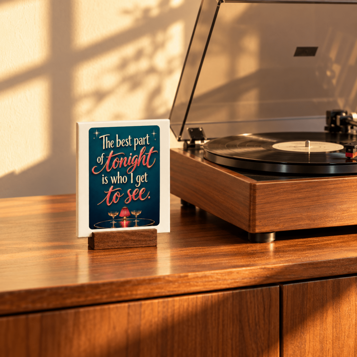 The Best Part of Tonight Mini Sign | Chrome & Starlight by Mirabilia Boutique sits by a vinyl record player on a wooden base, bathed in sunlight—a charming tabletop decor accent.