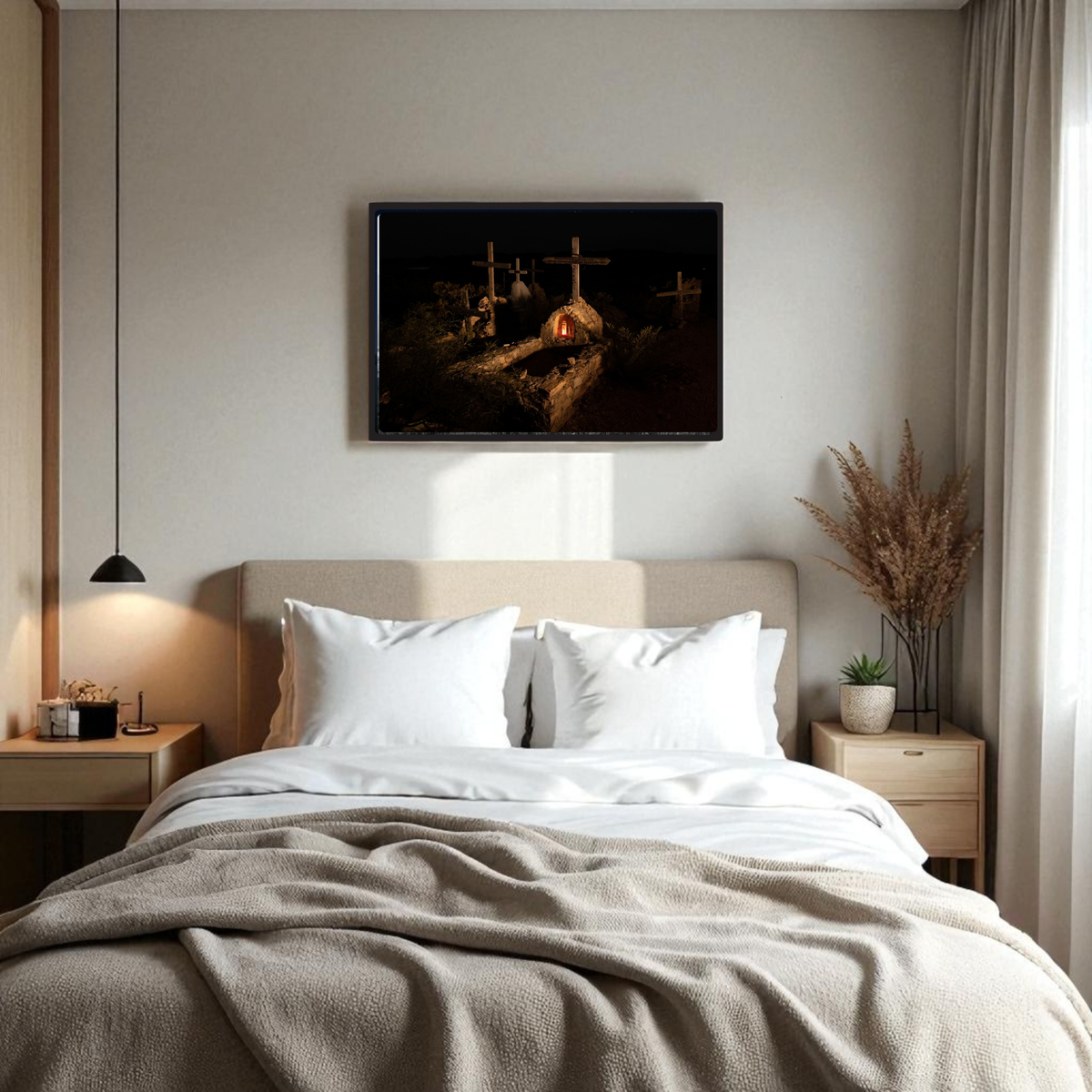 A cozy bedroom with a made bed, two side tables, a hanging lamp, dried plants in a vase, and the “Terlingua Cemetery at Night | Framed Fine Art Print” by Mirabilia Boutique—an artwork inspired by West Texas photography depicting three crosses at night and reminiscent of Terlingua Cemetery—hanging above the bed.