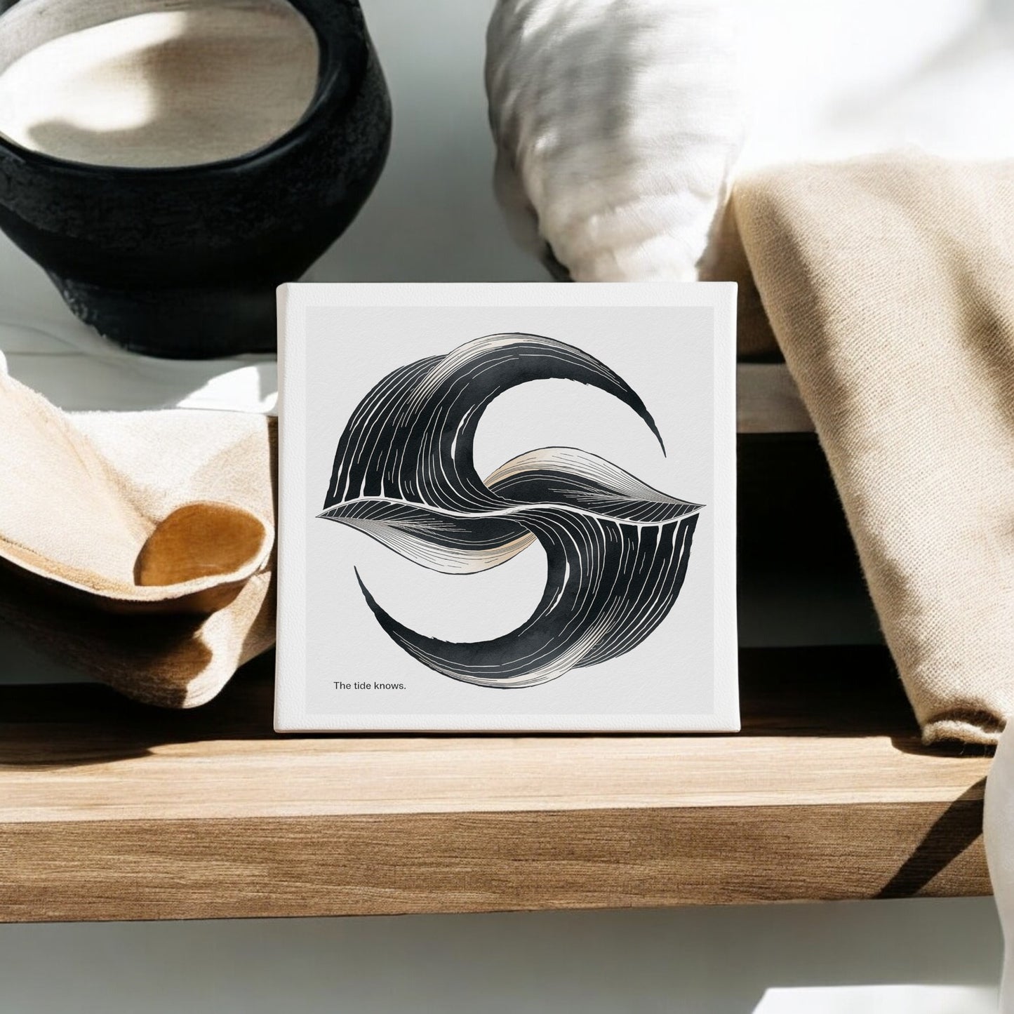 The Tide Knows Canvas by Mirabilia Boutique is an 8x8 abstract coastal wall art featuring black "S" brushstrokes and the text "The tide knows."—a minimalist accent for your meditation room.