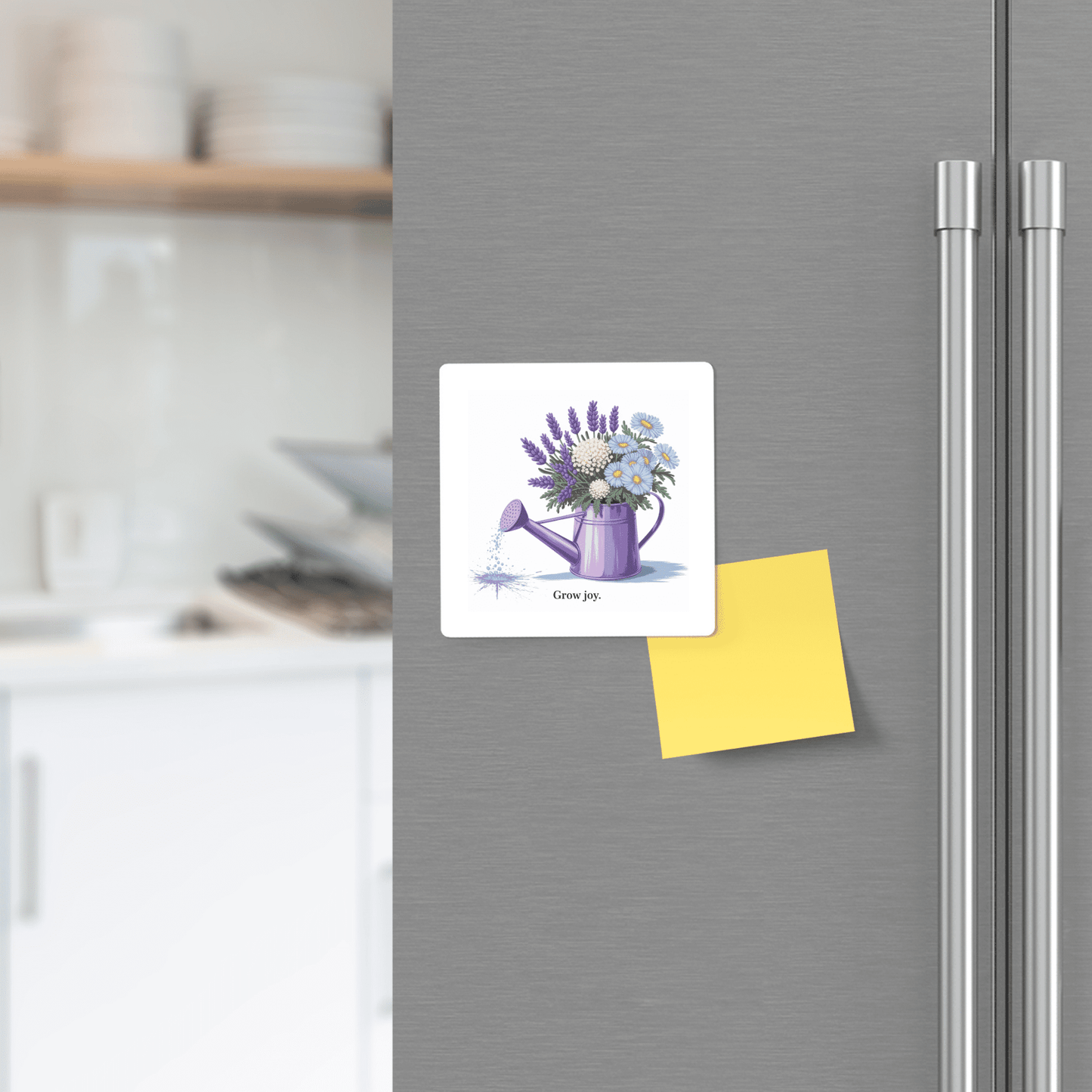 The Grow Joy Magnet – Watering Can & Soft Garden Florals by Mirabilia Boutique adds a floral touch to your fridge decor and makes a perfect gift for gardeners.