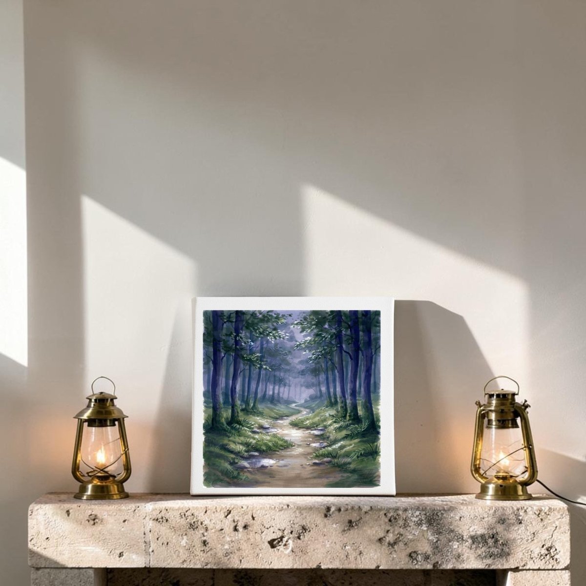 The Borrow a Little Moonlight Forest Canvas Wall Art by Mirabilia Boutique is beautifully displayed on a stone ledge between two glowing brass lanterns, as sunlight casts diagonal shadows across the plain white wall—creating a serene and tranquil wall decor vignette.