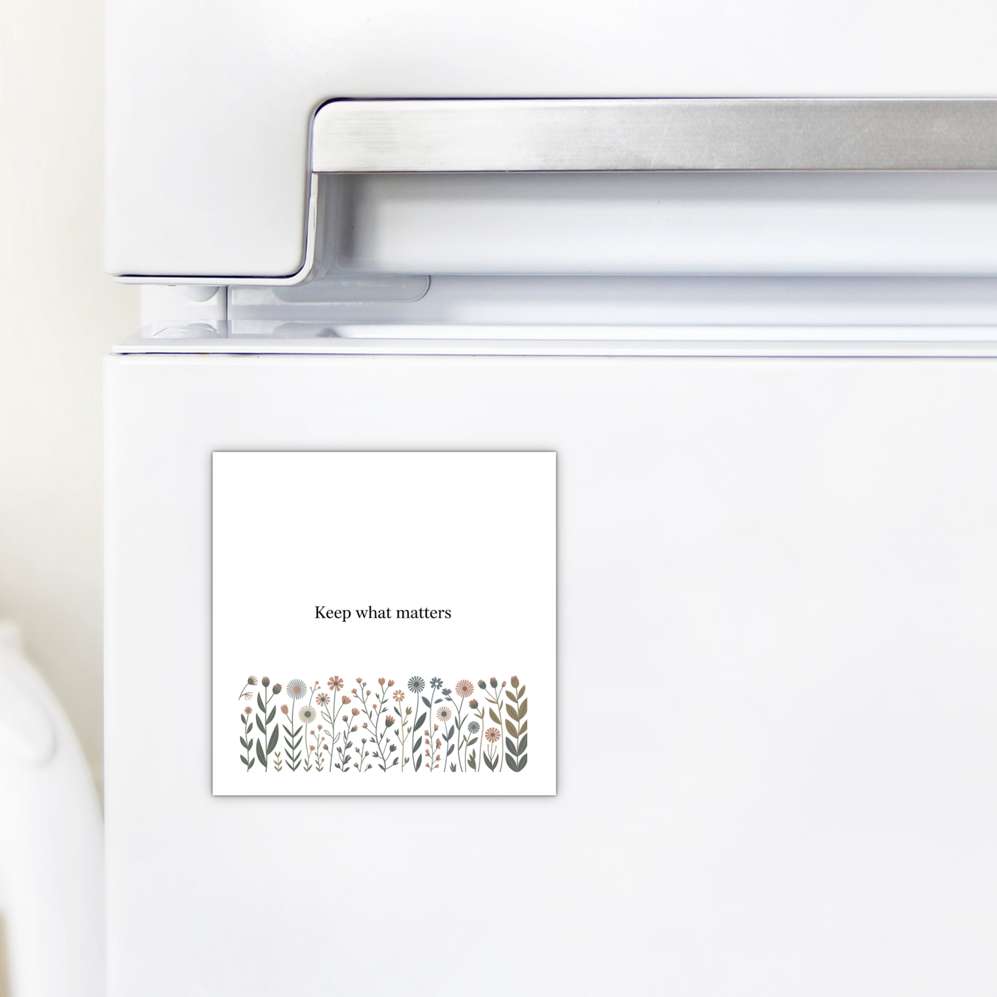 The Keep What Matters Floral Magnet by Mirabilia Boutique adds a charming cottage touch to any white fridge and makes a heartfelt gift with its inspiring message: "Keep what matters.