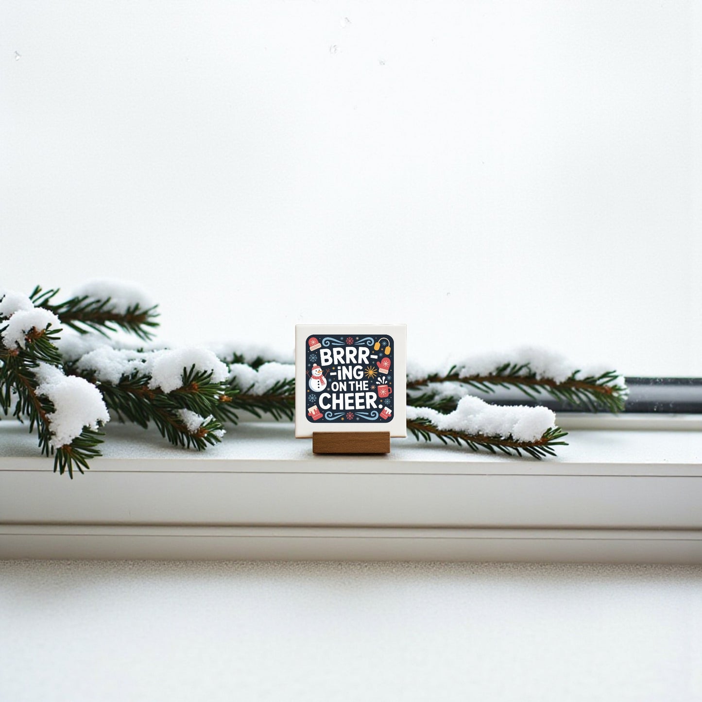 The Mirabilia Boutique Mini Brrr-ing on the Cheer Sign (4x4) adds festive charm to any shelf, tiered tray, or stocking. Its cheerful holiday design makes it a perfect seasonal decor piece or small gift.
