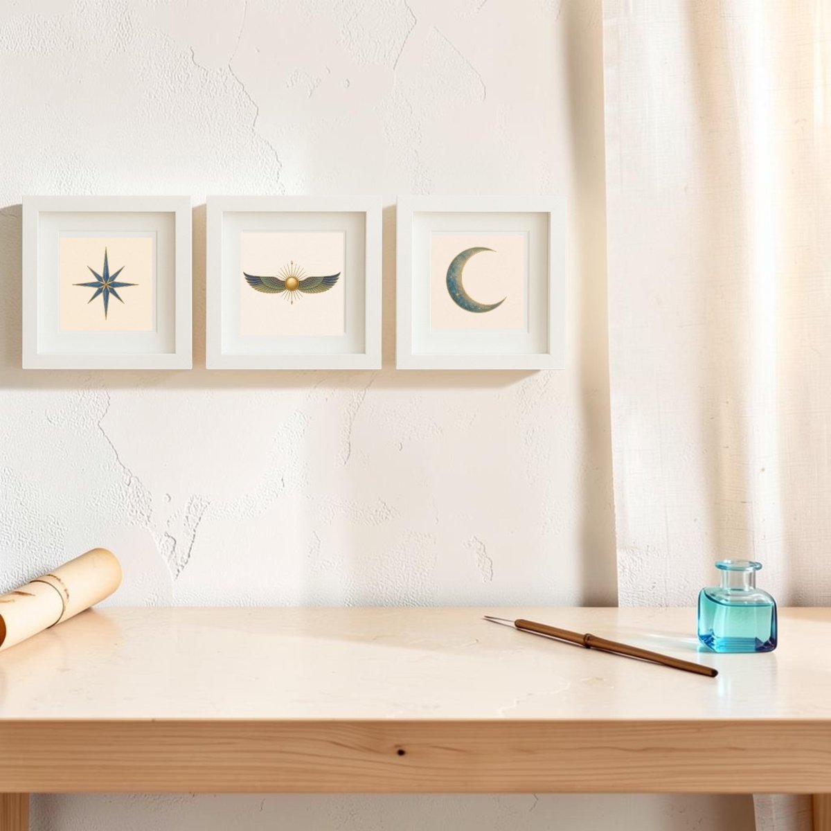 A minimalist desk adorned with a pen, ink bottle, and rolled parchment sits beneath three framed canvas prints from the “Celestial Relics of the Nile” collection by Mirabilia Boutique. Displayed against a textured white wall beside a cream curtain, each artwork features a unique celestial motif—a star, winged sun, and crescent moon. Soft natural lighting enhances the tranquil atmosphere in this refined setting.