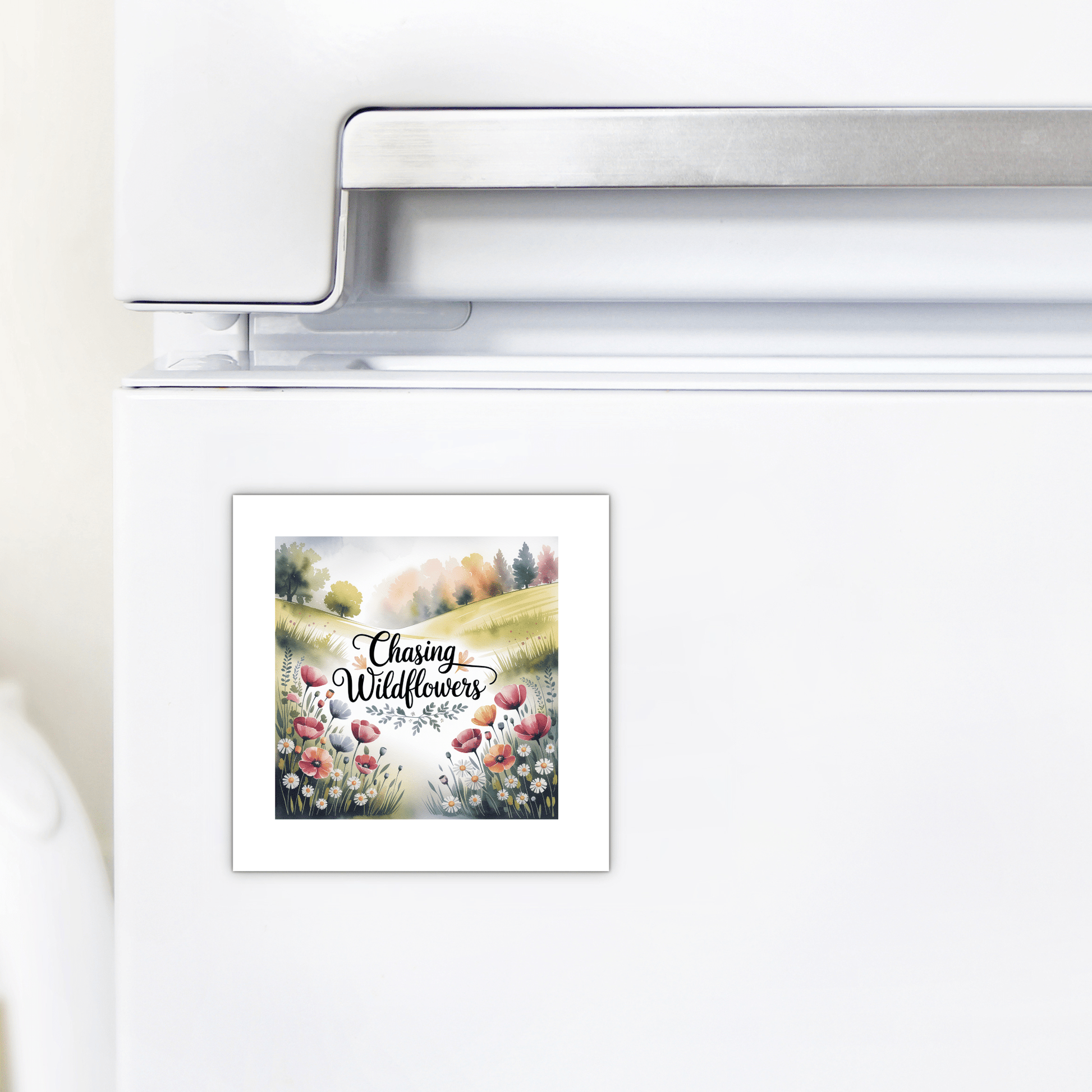 The Mirabilia Boutique "Chasing Wildflowers Magnet" is a botanical fridge decor featuring colorful wildflowers, hills, and trees with a nature quote—perfect for adding a touch of nature to any space.