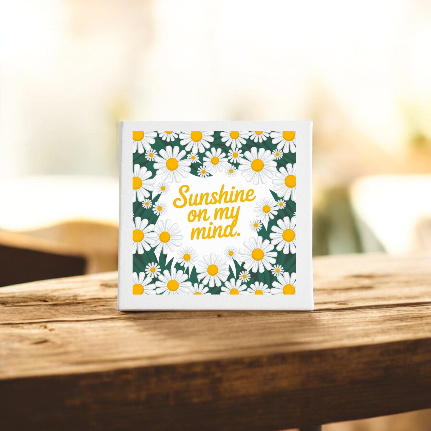 The Mirabilia Boutique Sunshine on My Mind Canvas (8x8) features a square design with white daisies and yellow centers framing “Sunshine on my mind” in yellow script—perfect daisy wall art for brightening any space.