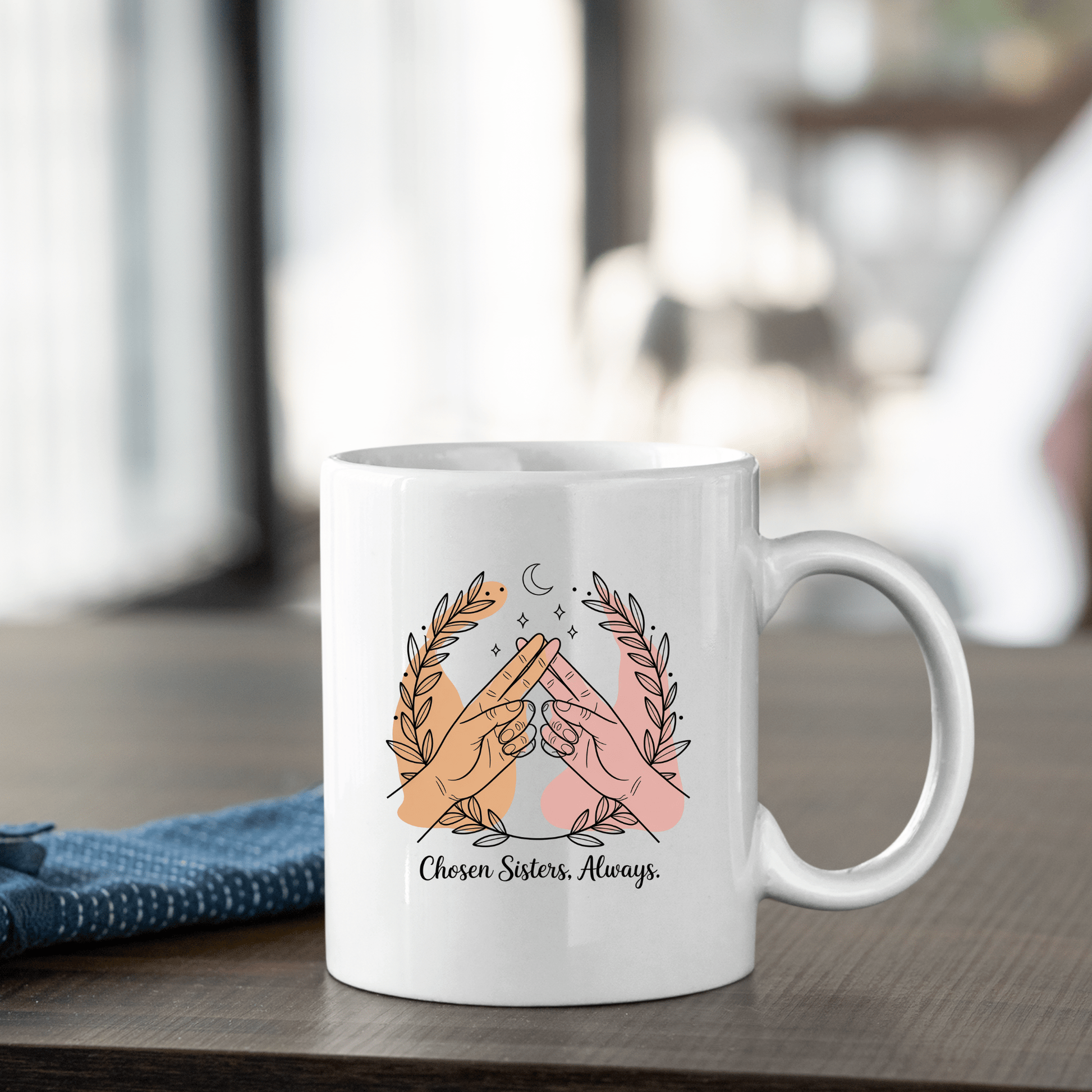 The Best Friend Mug from Mirabilia Boutique features two hands making a pinky promise and leafy branches with "Chosen Sisters. Always."—a perfect Galentine’s gift or friendship mug.