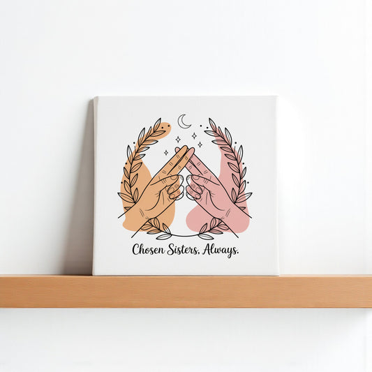 The Chosen Sisters Canvas by Mirabilia Boutique shows two hands of different skin tones touching pinkies under a crescent moon with laurels, captioned "Chosen Sisters. Always."—a heartfelt friendship gift for best friends.