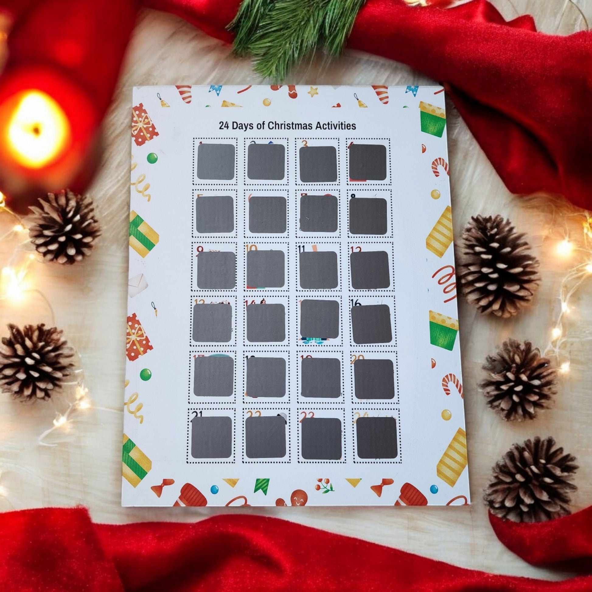 The 24 Days of Christmas Activities Scratch Off Calendar by Mirabilia Boutique is a Christmas-themed advent calendar offering 24 days of festive fun on a table. Adorned with motifs like candy canes and ornaments, it is complemented by pinecones, red fabric, and glowing string lights for delightful holiday décor.