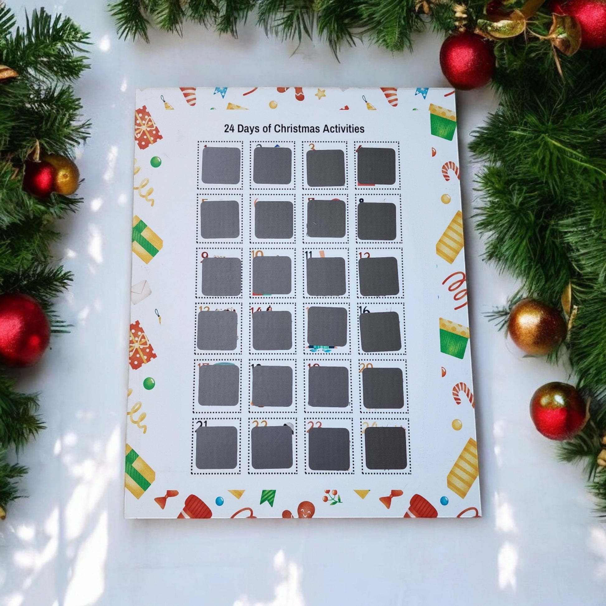 The 24 Days of Christmas Activities Scratch Off Calendar by Mirabilia Boutique brings festive fun with 24 engaging activities. Surrounded by lush green pine branches and glittering red and gold ornaments, it makes a charming centerpiece in your holiday décor.