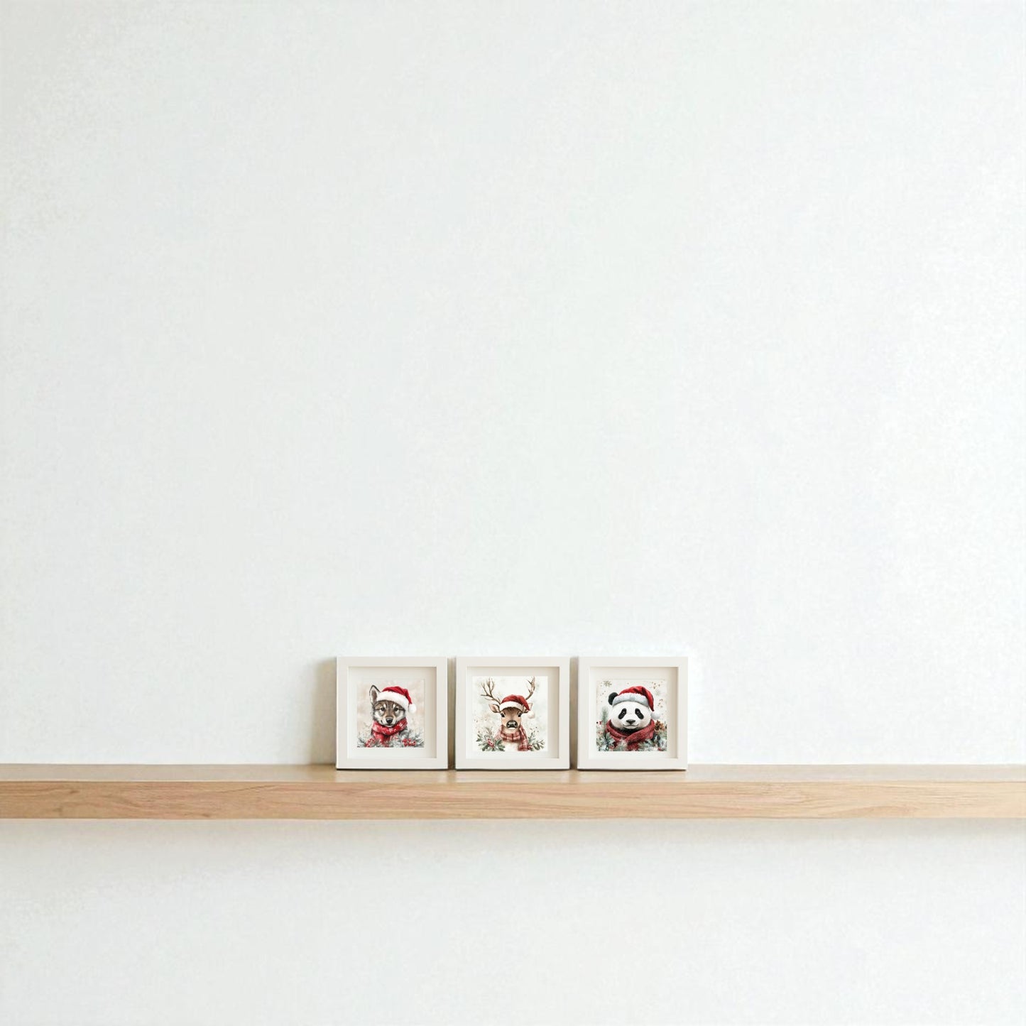 The Wolf, Deer & Panda Christmas Trio 5x5 Holiday Shadowbox Set from Mirabilia Boutique features minimalist animal art in Santa hats—perfect woodland Christmas decor for any space.