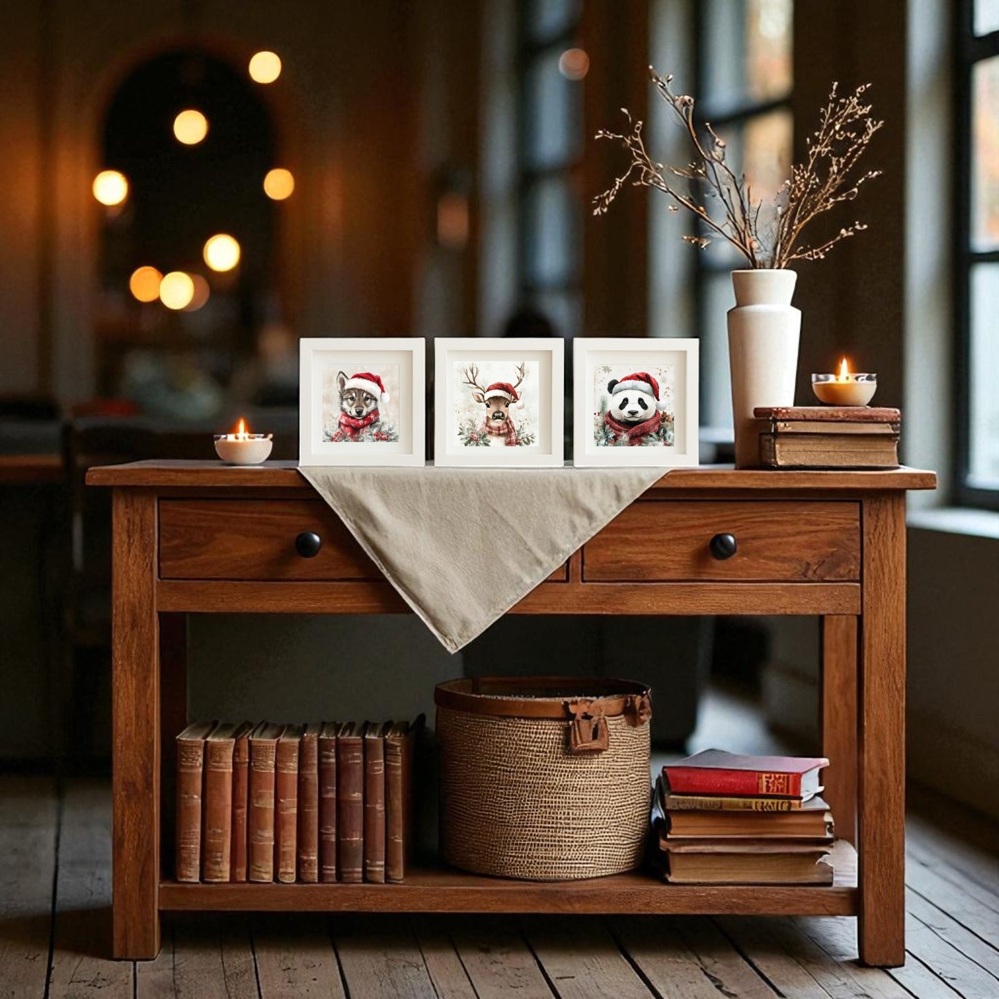 The Mirabilia Boutique Wolf, Deer & Panda Christmas Trio 5x5 Holiday Shadowbox Set, styled with candles, books, a basket, dried branches in a vase, and warm lighting, creates cozy woodland Christmas decor in a mirror-lined room.