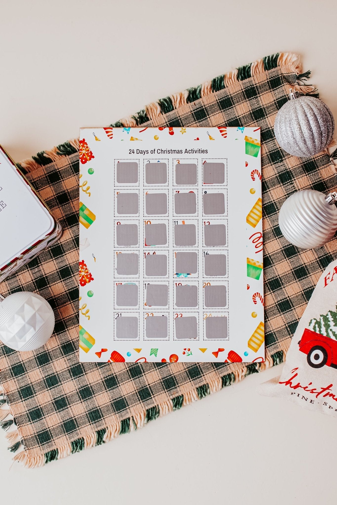 The Mirabilia Boutique Scratch-Off Christmas Activity Calendar features 25 festive family activities for kids and serves as a fun holiday countdown and winter bucket list poster.