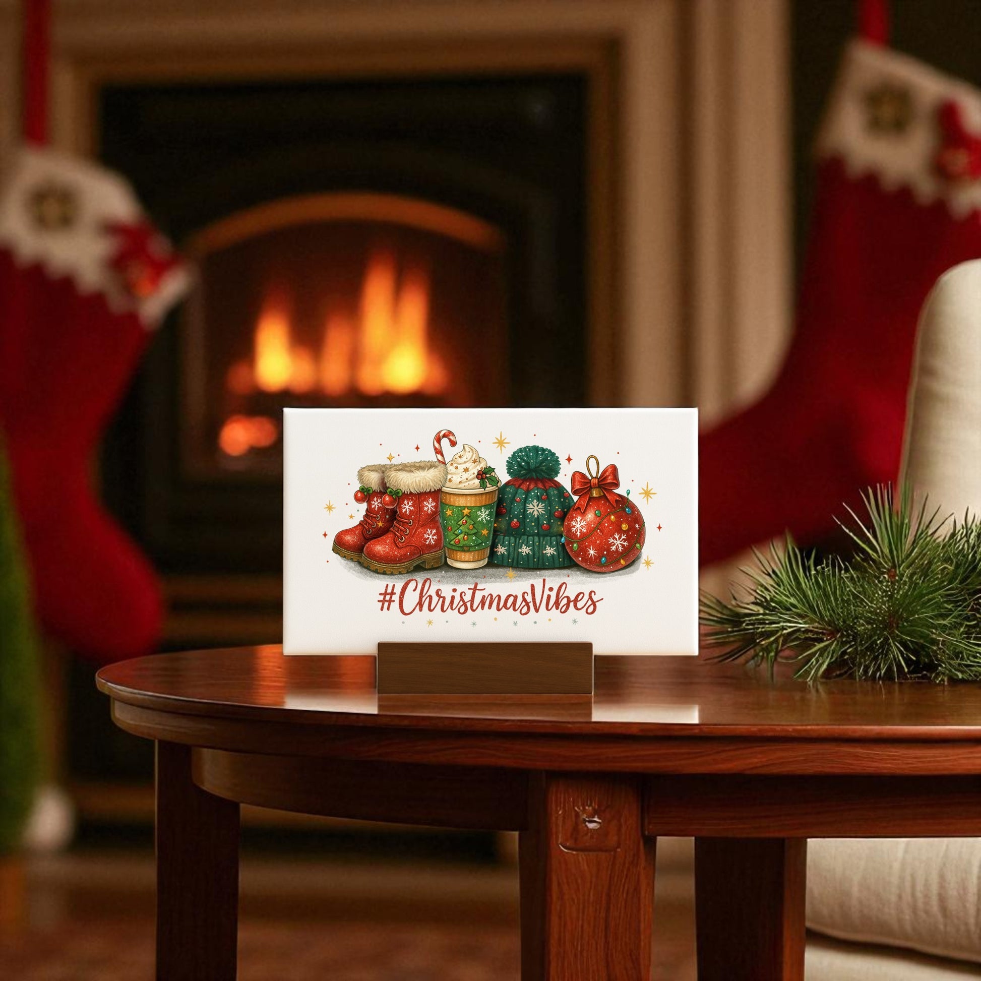The Mirabilia Boutique Christmas Vibes 6x4 Canvas Sign features festive stockings and gifts on a wooden table by a glowing fireplace, with "#ChristmasVibes" text and cheerful decor—perfect holiday decor for your home.