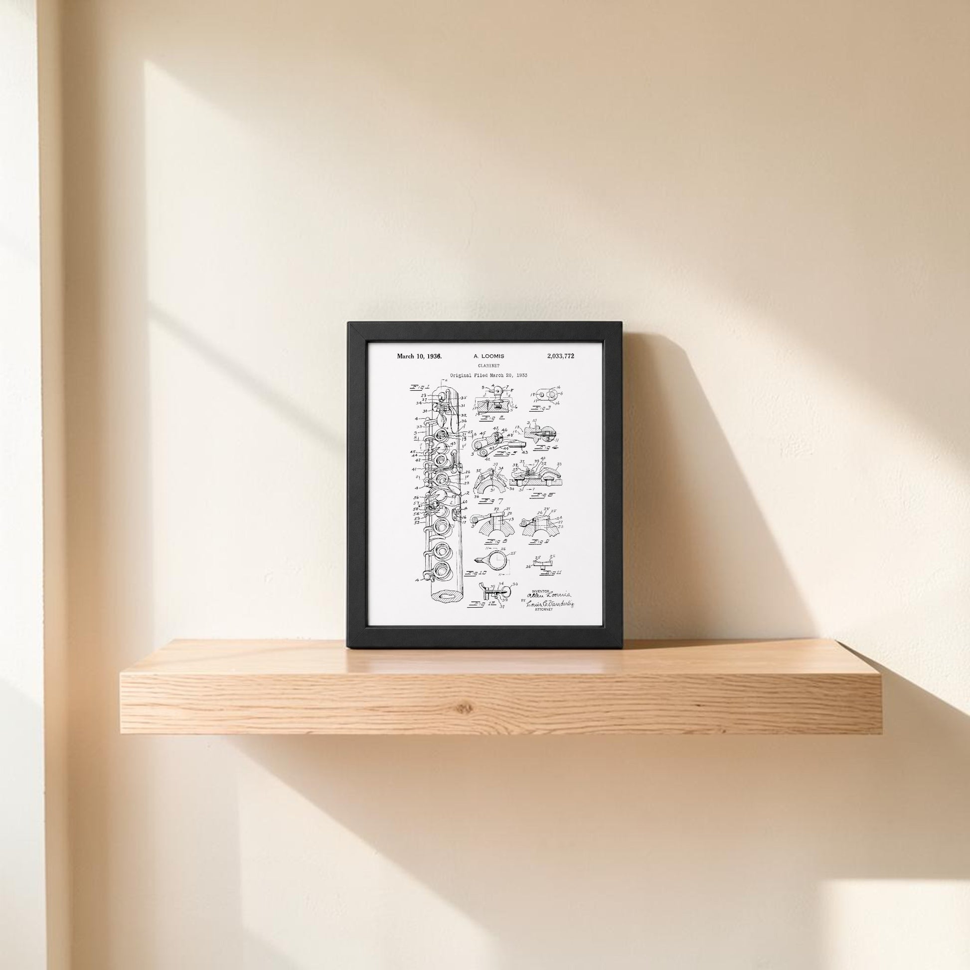 The Clarinet Patent Print on Metal Wall Art by Mirabilia Boutique is displayed on a simple wooden shelf against a light wall, sunlight casting soft shadows—an elegant addition to your music room décor.