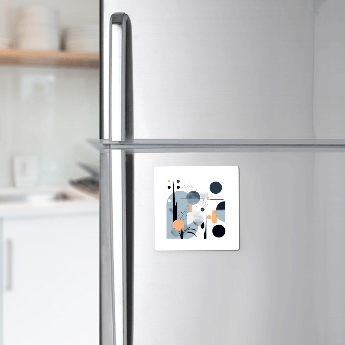 A stainless steel refrigerator displays the Coastal Sunrise Mid Century Modern Magnet by Mirabilia Boutique, featuring geometric shapes and muted colors, in a modern kitchen setting.