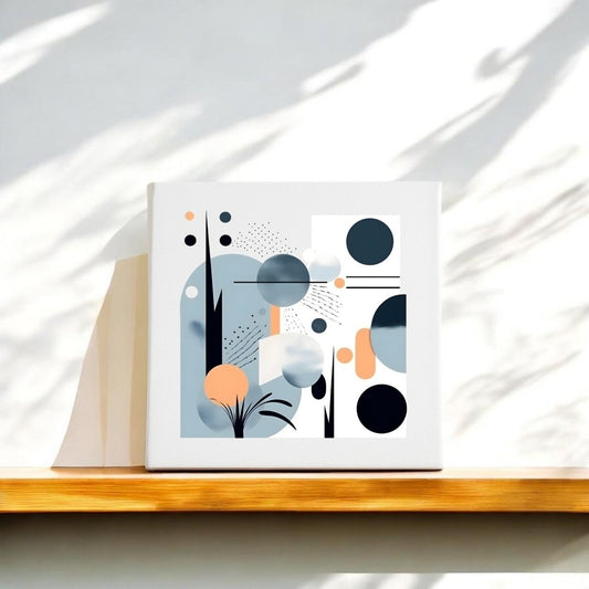 The Coastal Sunrise Mid Century Modern Canvas by Mirabilia Boutique features abstract geometric shapes in black, blue, and orange on white, displayed on a wooden shelf with natural light and shadow accents.