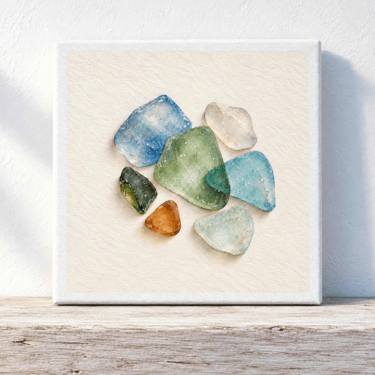 Colors the Tide Leaves Canvas square wall art featuring a small arrangement of multicolored sea glass pieces against a cream-colored textured background.