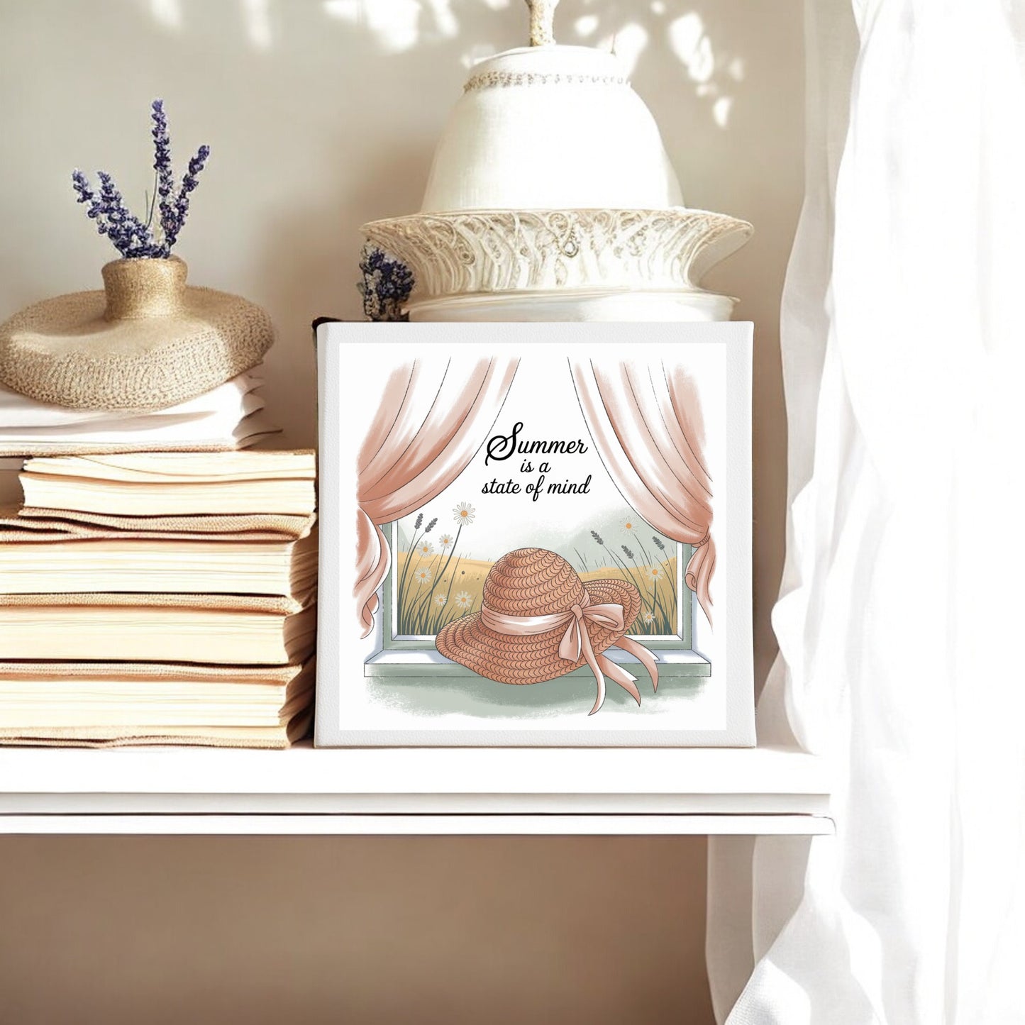 A shelf displays stacked books, a decorative hat, a white vase, and Mirabilia Boutique’s "Summer Is a State of Mind Canvas – Soft Cottagecore Art," featuring a sun hat, wildflowers, and sunlight for cozy countryside charm.