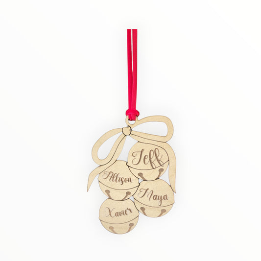 The Mirabilia Boutique Custom Family Christmas Ornament features laser-cut wood shaped as three jingle bells and a bow, personalized with the names Jeff, Allysen, Xavier, and Maya. This festive ornament hangs from a red ribbon.