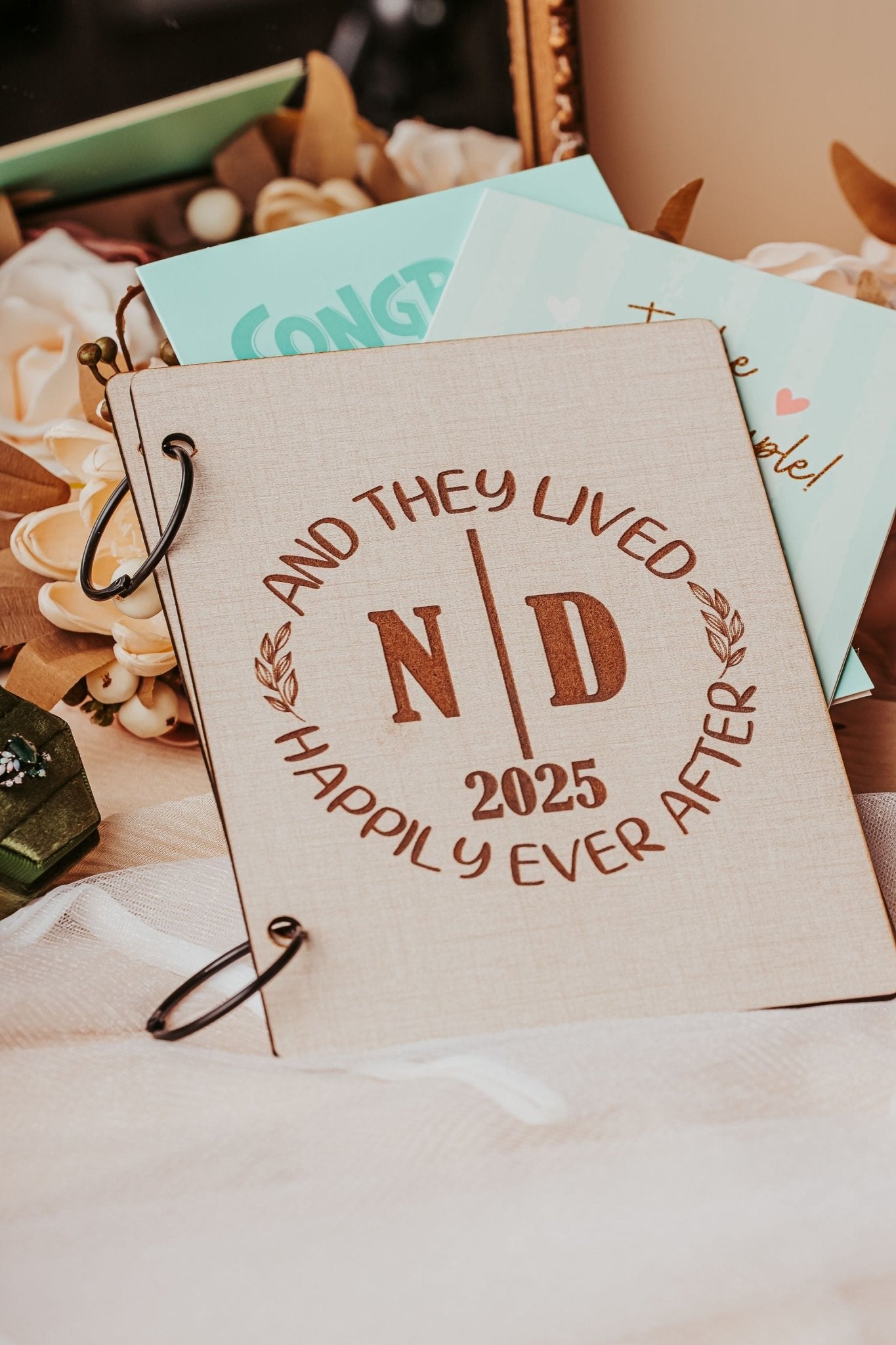 The Mirabilia Boutique Wedding Card Keepsake Binder | Personalized Memory Book features "AND THEY LIVED HAPPILY EVER AFTER N | D 2025" on a beige cover—an ideal wedding card keepsake, perfect for preserving treasured memories.