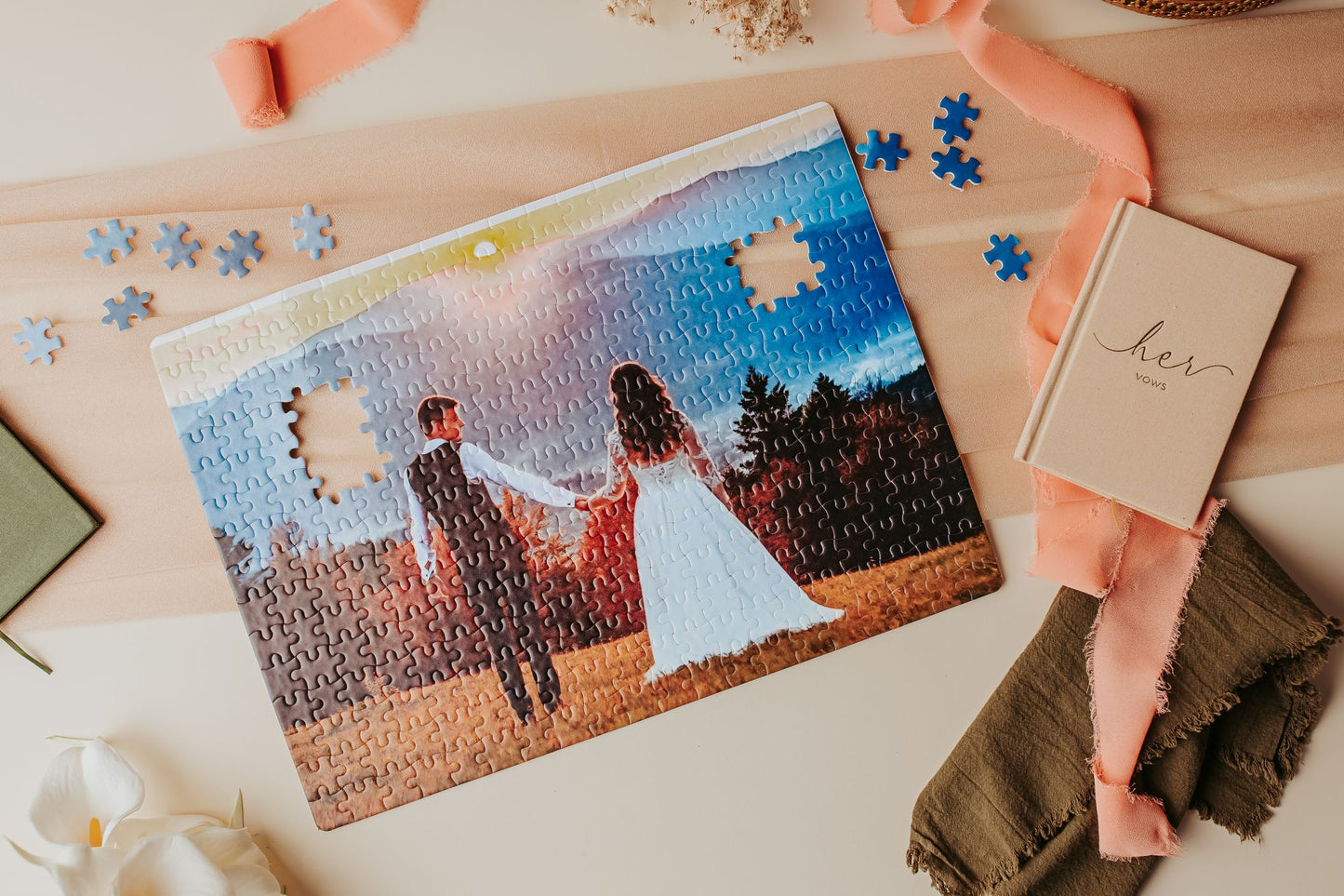 The Mirabilia Boutique Custom Wedding Jigsaw Puzzle is a 300-piece photo keepsake showing a couple in wedding attire, blue pieces, and a "her vows" book—making it a thoughtful personalized wedding gift.