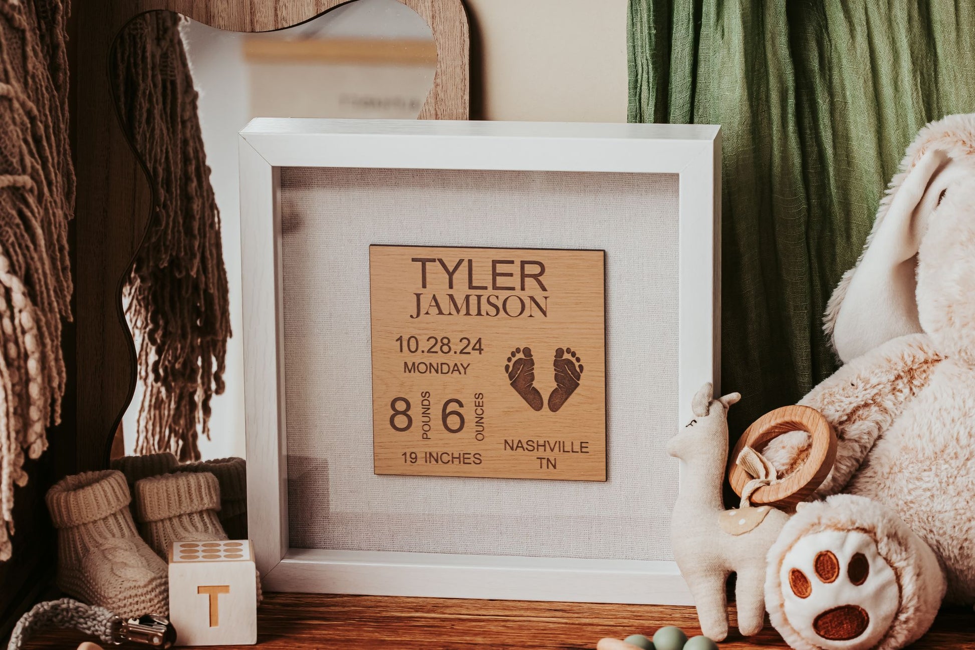 The Mirabilia Boutique Personalized Baby Birth Stats Shadowbox, a 9x9 laser engraved keepsake, displays custom newborn details and footprints—a heartfelt nursery gift and unique name sign for new parents.