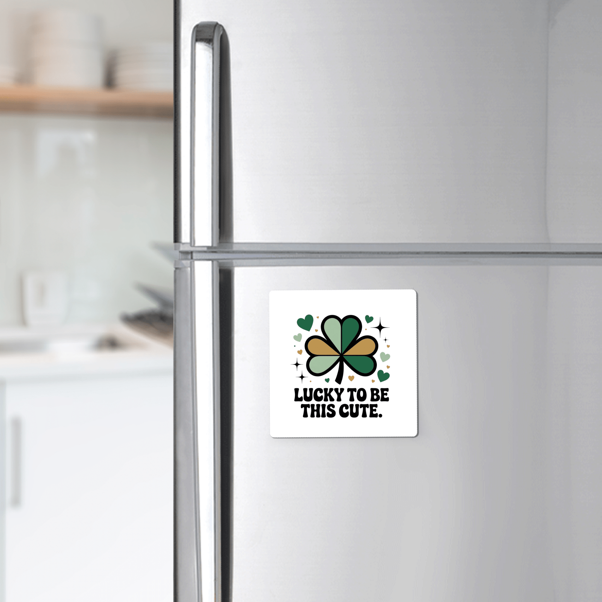 The Lucky to Be This Cute Magnet by Mirabilia Boutique features a shamrock, hearts, and sparkles with "Lucky to be this cute" text—a charming St. Patrick’s Day clover gift for any modern kitchen fridge.