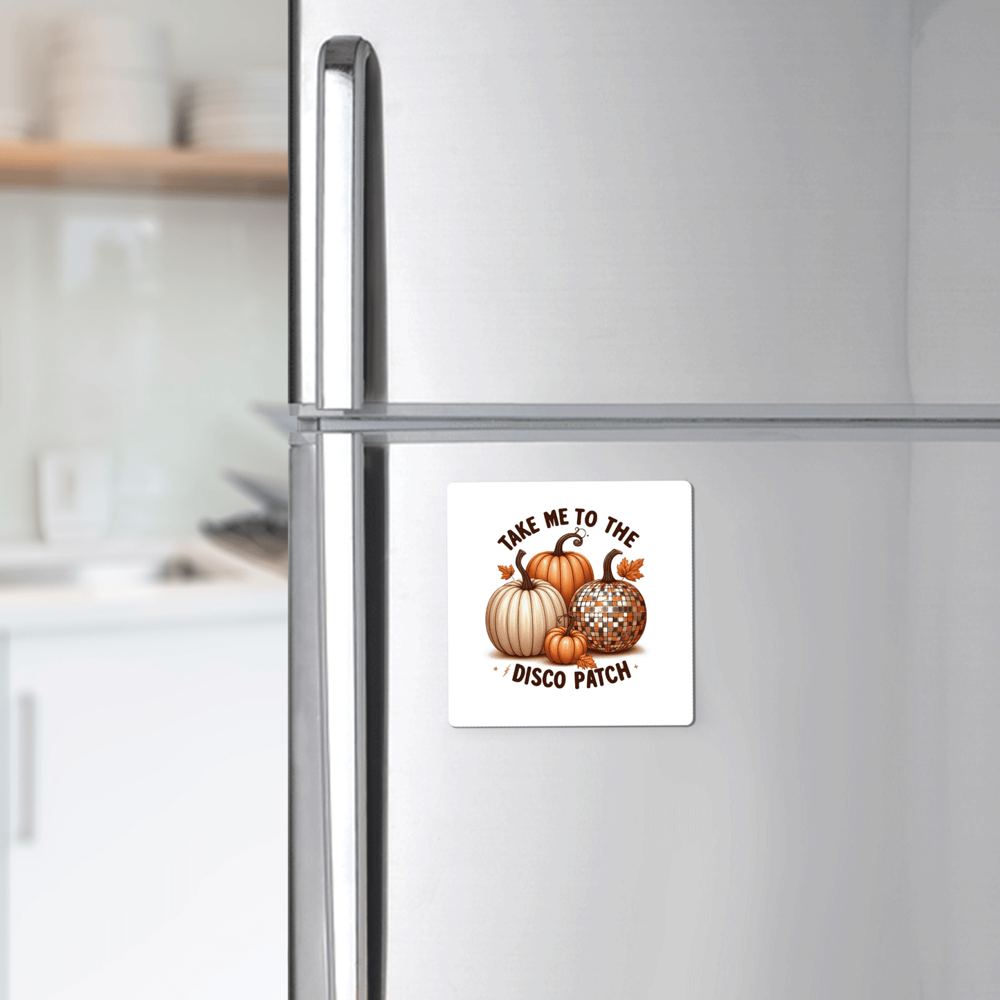 The Disco Patch Pumpkin Magnet by Mirabilia Boutique adds retro flair to your fridge, featuring pumpkins and disco balls with "Take me to the disco patch"—a perfect touch of fun fall decor for your modern kitchen.