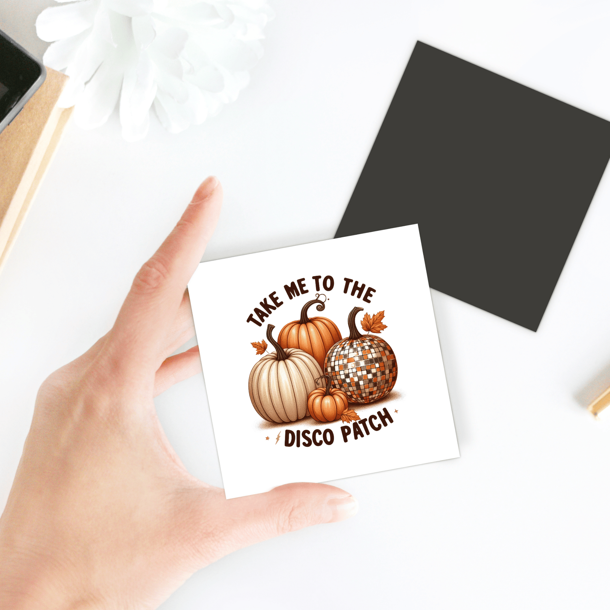 A hand holds a square Mirabilia Boutique card with three pumpkins—including the Disco Patch Pumpkin Magnet—and the text “Take me to the disco patch.” Perfect fall fridge decor with retro flair.