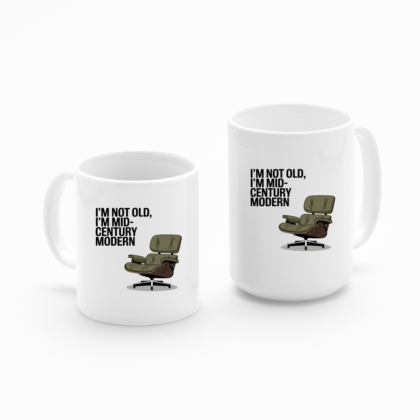 The Mirabilia Boutique Mid-Century Modern Mug with Retro Humor set includes two white ceramic mugs—one smaller, both featuring a vintage lounge chair illustration and the phrase "I'M NOT OLD, I'M MID-CENTURY MODERN.