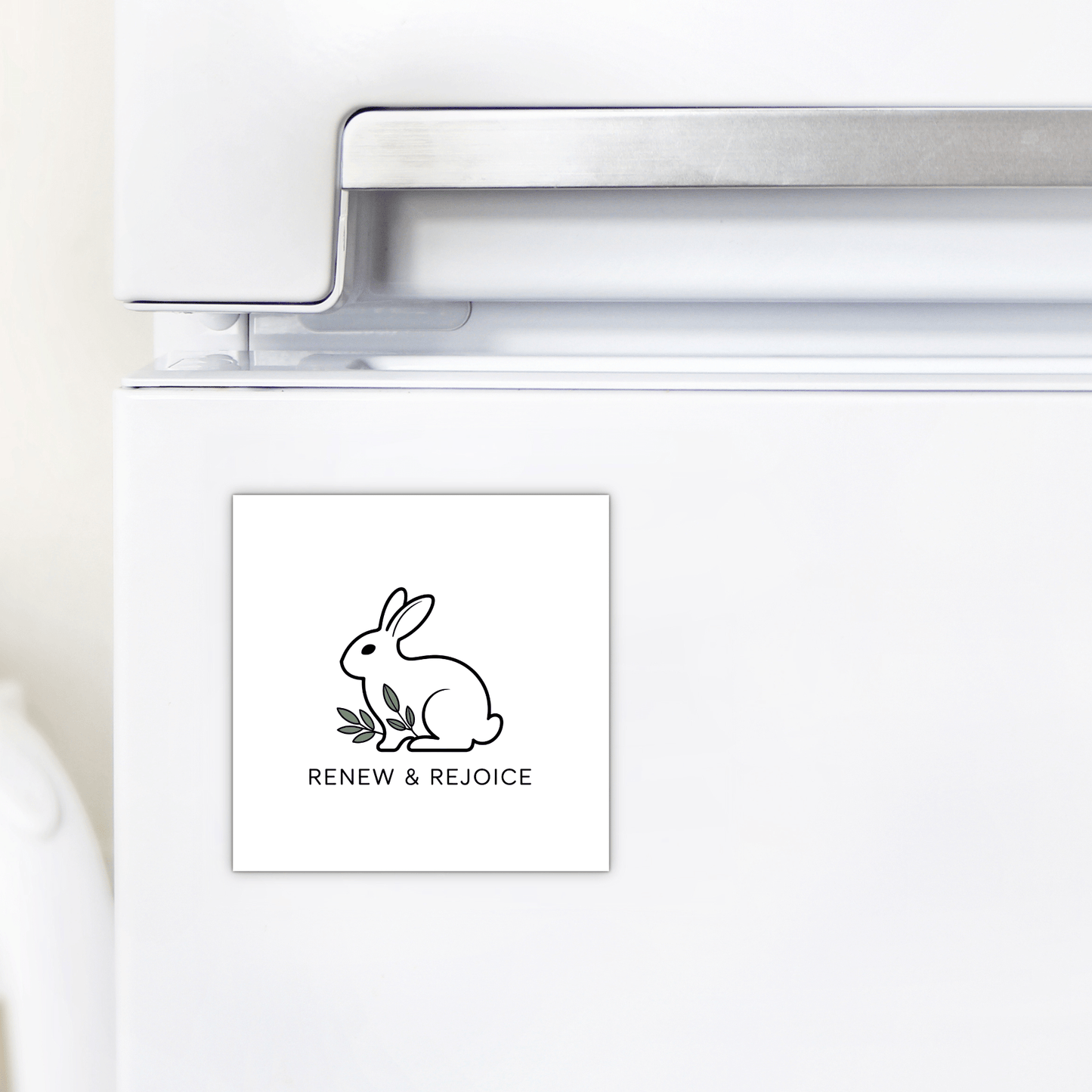 The Renew & Rejoice Magnet – Minimalist Bunny Design by Mirabilia Boutique features a simple bunny line drawing and “RENEW & REJOICE” text—a delightful mindfulness reminder and perfect Easter basket filler for your fridge.