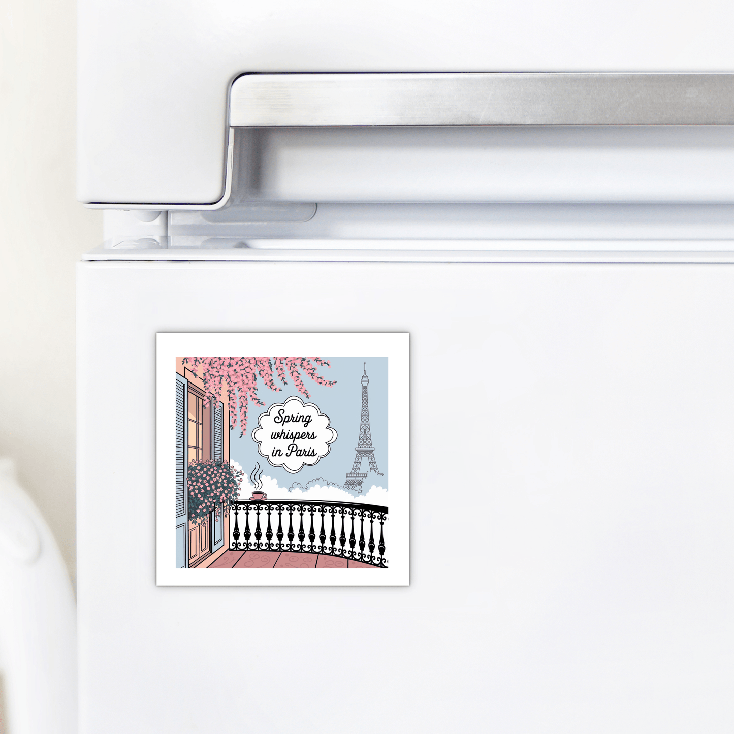 The Mirabilia Boutique Spring Whispers in Paris Magnet – Eiffel Tower View shows a blooming balcony scene with the Eiffel Tower, featuring a thought bubble: "Spring arrives in Paris." A charming gift for lovers of Paris and the Eiffel Tower.