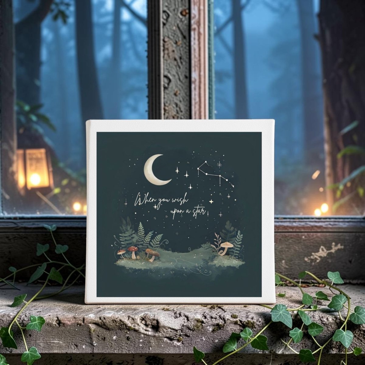 The "When You Wish Upon a Star Woodland Canvas" by Mirabilia Boutique features a dreamy scene of the moon, twinkling stars, and playful mushrooms with the inspiring phrase "When you wish upon a star," all set upon a windowsill adorned with ivy. Lanterns glow softly against the backdrop of a misty forest through the window, creating an enchanting piece perfect for any woodland nursery wall art collection.
