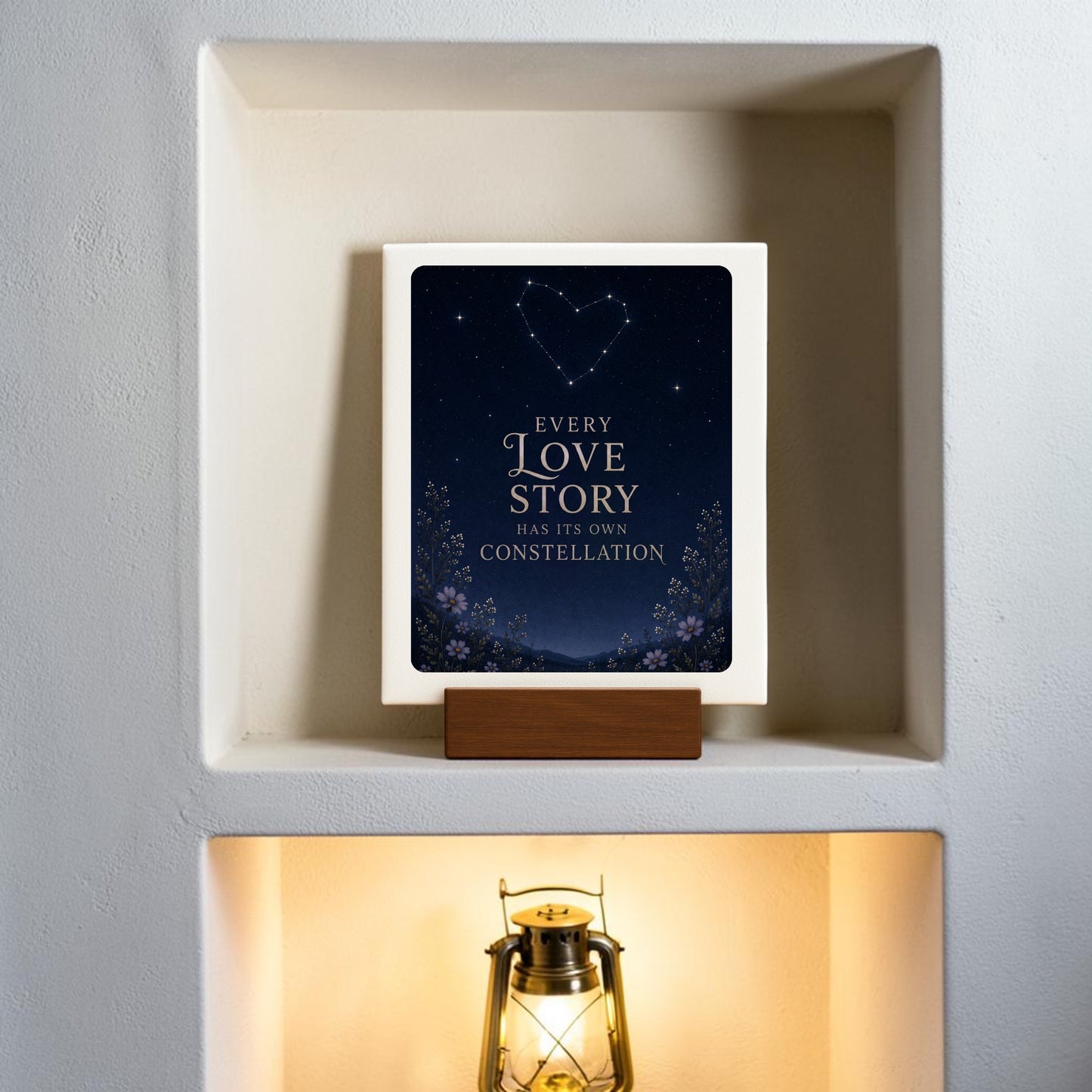 The Every Love Story Constellation Mini Sign by Mirabilia Boutique features the phrase “Every love story has its own constellation” and a heart-shaped constellation above—a charming piece from their Celestial Decor collection, ideal for displaying on a niche shelf above a lantern or anywhere you want to add a touch of starlit romance.