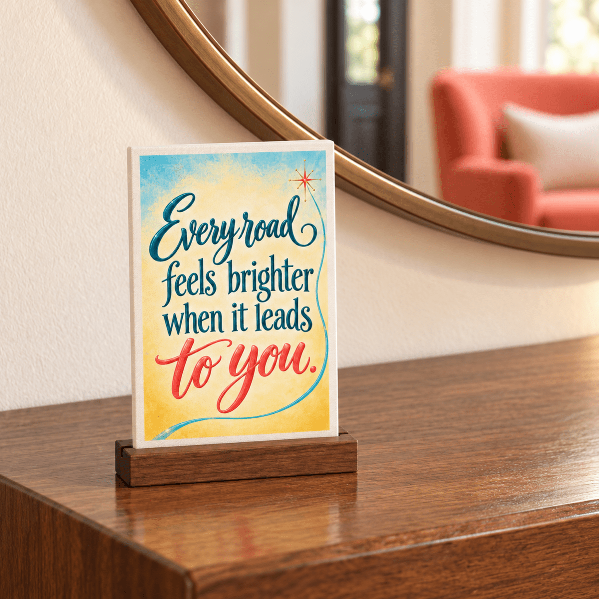 Every Road Feels Brighter Mini Sign | Chrome & Starlight: a small rectangular mini canvas sign in a wooden stand featuring expressive lettering in blue, yellow, and red.
