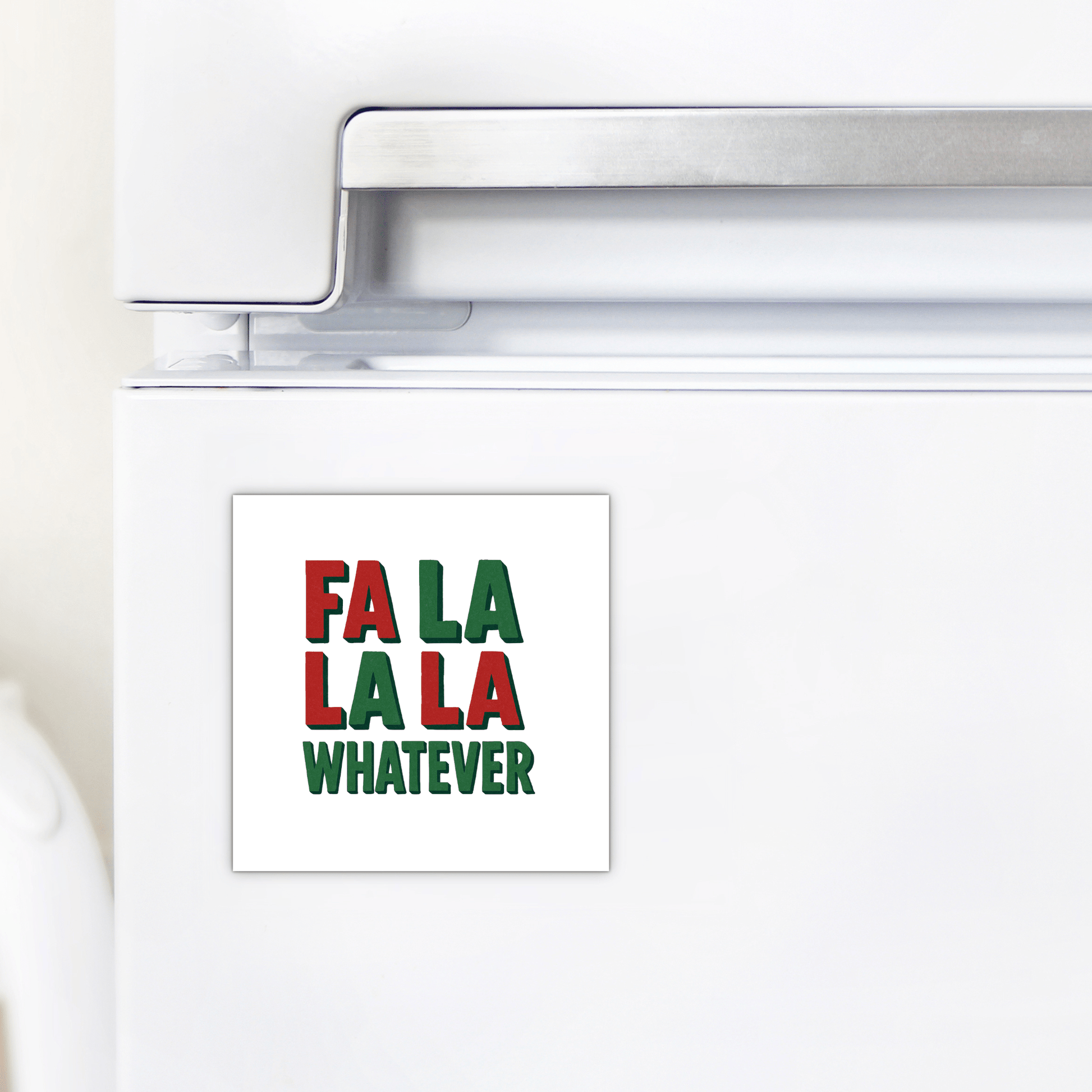 A white refrigerator door features the Fa La La La Whatever Magnet by Mirabilia Boutique, a funny Christmas gift idea with red and green text—a perfect touch of holiday sarcasm.