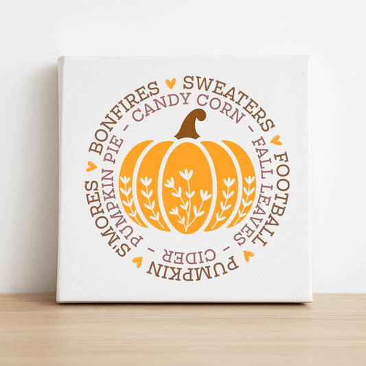 The Fall Pumpkin Canvas by Mirabilia Boutique features an orange pumpkin surrounded by autumn words—ideal 8x8 wall art for cozy spaces or as festive autumn decor.