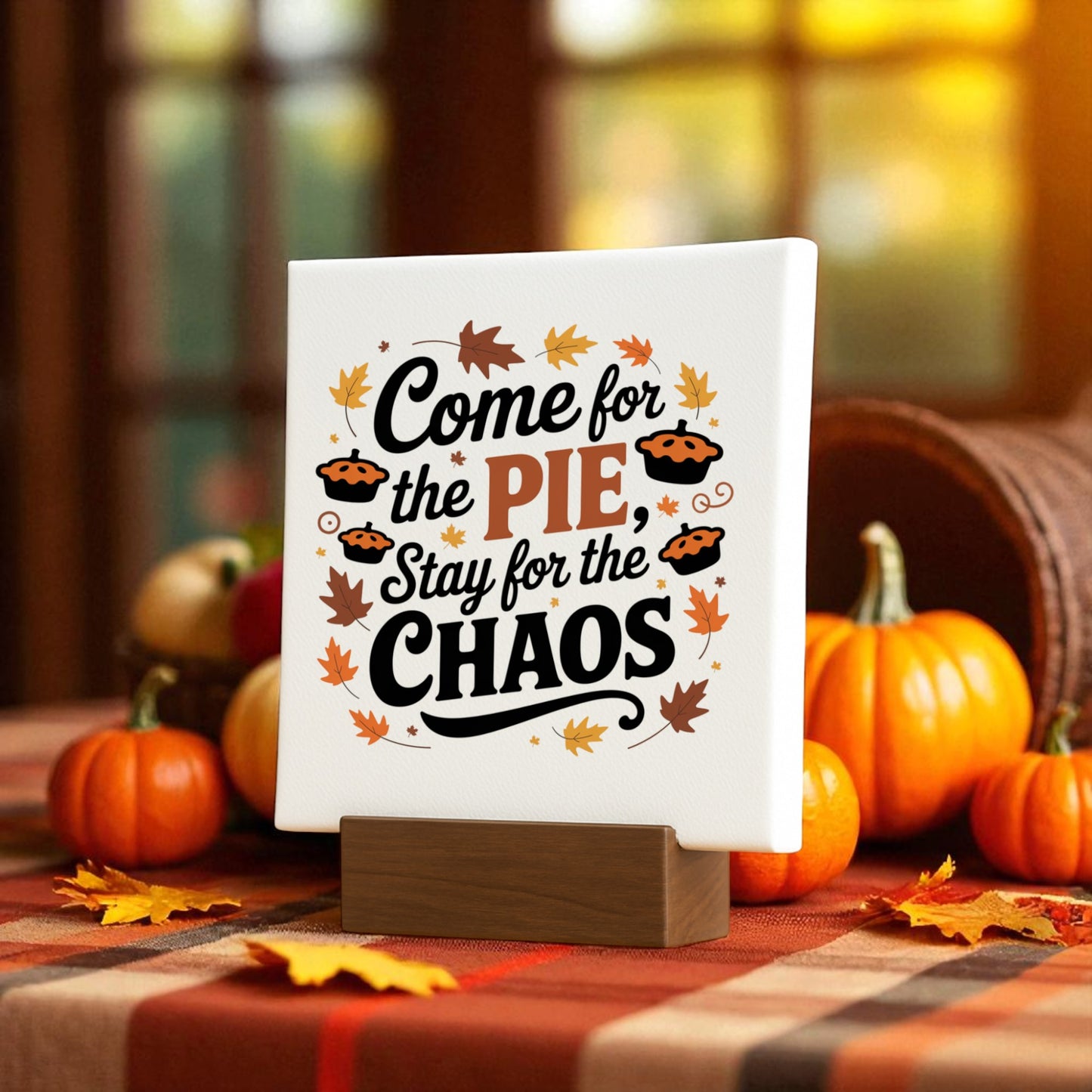 The Pie & Chaos Funny Fall Decor Mini Thanksgiving Sign by Mirabilia Boutique features “Come for the pie, stay for the chaos” with pumpkin and leaf art on a wooden stand—perfect autumn decor for your table or mantel.